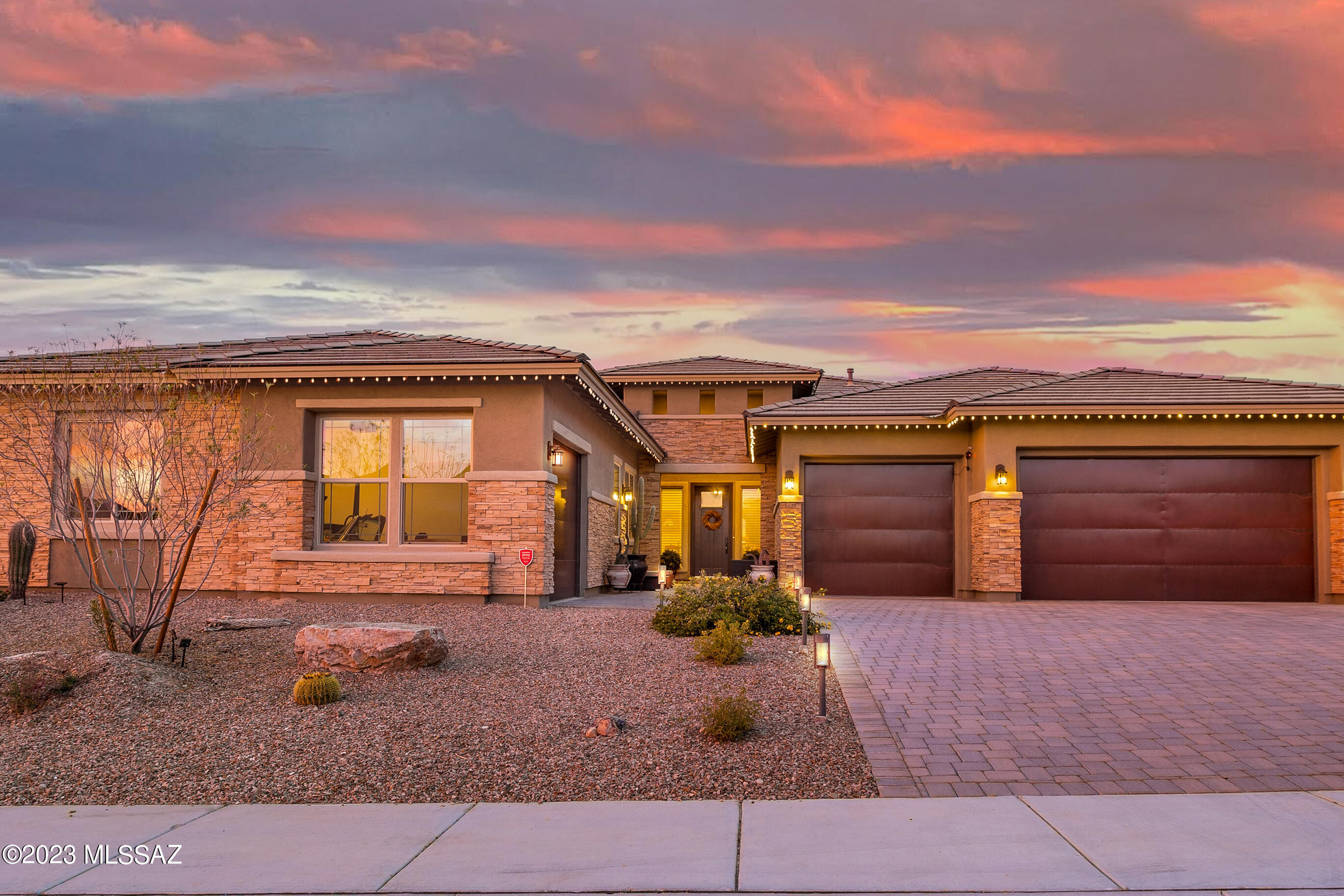 Nothing was overlooked and everything was upgraded in this Dove Mountain Beauty! Let Turquoise Hills be your oasis in the desert!  Be sure to check out the showcase video and walk through to see all of the details this home has to offer. The premium lot backs to The Golf Club at Dove Mountain and sits on 1/4 acre. Construction was completed in 2020 - 4 bedrooms plus a den (one guest bedroom is an ensuite), 3 1/2 baths, 3,491 s/f, 4 car garage and a large great room with vaulted ceilings. Monogram Professional Kitchen Package includes a large Island, upgraded cabinetry with glass doors and accent lighting, soft close cabinets and drawers, pull out shelving, under cabinet lighting, pot filler, an upgraded professional stove with griddle, huge walk in pantry, desk area off kitchen and key drop at main garage entry. The dining room is nice and open and features custom accent tile on ceiling. Large, beautifully decorated laundry room with sink that has pass through  into the primary closet area and hall to secondary bedrooms. The generous primary suite offers great views and a bathroom spa retreat you are sure to love - large upgraded shower with soaking tub inset, dual walk in closets, dual sinks with vanity, and upgraded leather mirrors. You will truly feel like you are at a resort in the backyard - upgraded dual sliders, extended covered patio with dual fans, outdoor tv, travertine tile, artificial turf, custom pool with water feature, accent lighting and smartphone operation, swim up bar and sunken outdoor kitchen. Dove Mountain is home to the Ritz Carlton, two premium golf courses (Dove Mountain and The Gallery), new Stem School, convenient access to I-10, shopping and dining.  One year of golf cart fees will be covered for you should you wish to join Dove / Gallery.