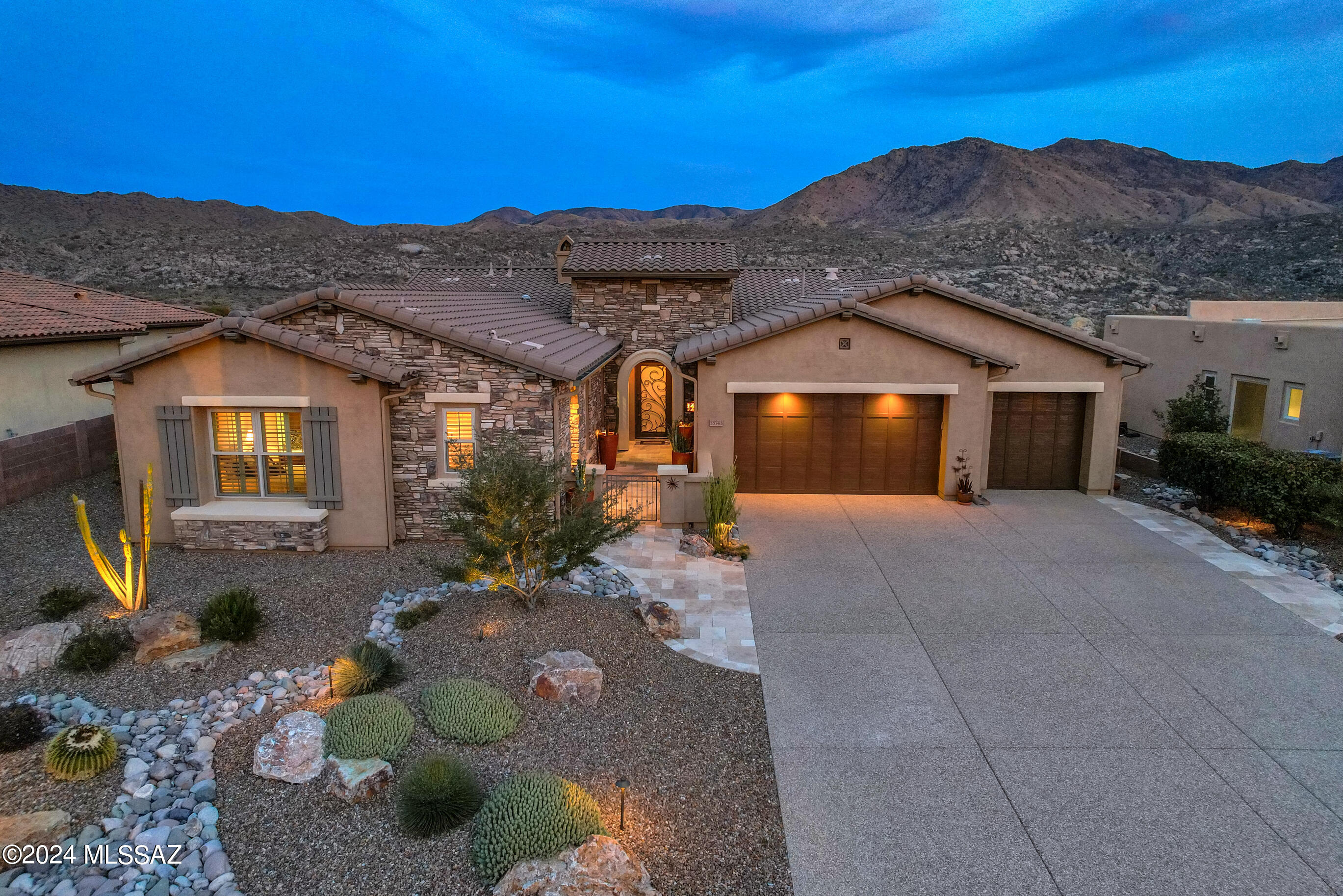 A True Gem in The Preserve at SaddleBrooke. Spectacular, unobstructed views of the Catalina Mts. Located on a very quiet cul-de-sac. 1/3 AC lot sits high above the golf course driving range with wide open vistas.  Popular ''Acacia'' model with a guest casita has many upgrades inside and outside.  Enter the spacious foyer to a warm and welcoming interior where mountain views dominate. 
The great room features a Heatilator gas fireplace and a stackable, sliding glass door system opening to the covered patio with automatic solar screen. Beautiful Travertine stone patios installed front and back.  Sweeping vistas surround you from the artistically landscaped back patio with custom seating around the gas firepit & multiple areas for entertaining. Separate outdoor cooking center with gas grill, Traeger Grill, lighting, and counter with bar seating. Landscape lighting front & back on sensor & timer. 
Cart path at the end of cul-de-sac is quick access to Club House and Golf driving range.
Inside the beautiful wood floors run through all the common areas with tile in bathrooms, carpet in guest BR & casita.
Gorgeous granite covers the kitchen counters with tile backsplash. Soft close cabinets with roll out shelves, under cabinet lighting, gas cook top & walk-in pantry. 2023 New Bosch dishwasher and new microwave.
Separate bar with beverage refrigerator, granite counter, upper cabinets with lights & glass front. 
Solar tube in the half bath. 
Extended den/study. 
Sliding barn door offers privacy for the master bath. 
Remote controlled auto screens for patio and east/south windows.
Iron entry door has opening glass section with screen.
Home security system.
Aggregate driveway. Garage with storage cabinets & utility sink.
Casita with microwave, refrigerator, quartz bar/counter with extensive cabinets. The bath has a walk-in shower. Entry hall and closed-in closet.
Custom window treatments and plantation shutters.
Most furnishings are available for sale on a separate Bill of Sale.
