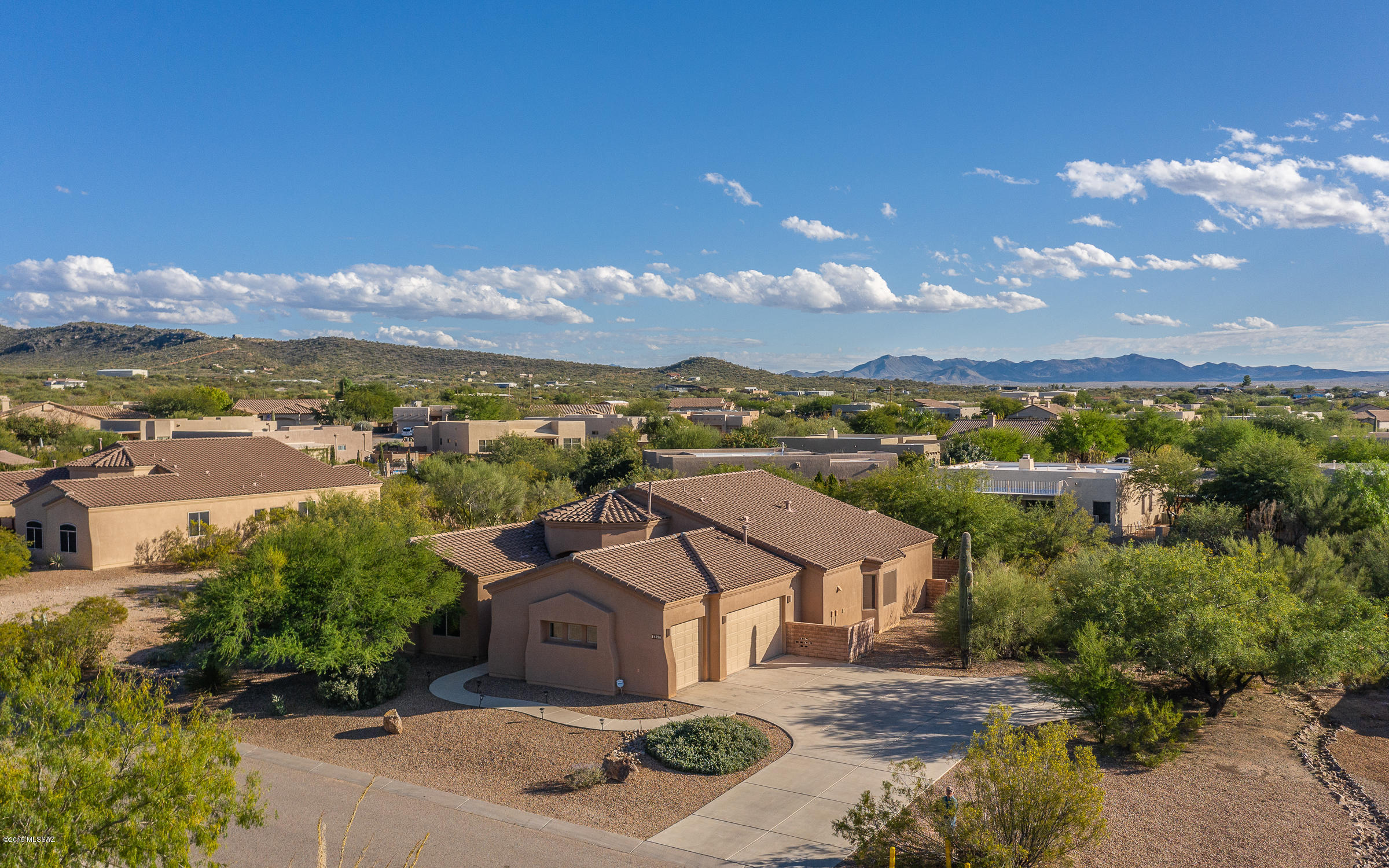 Enjoy sunsets, mountain views, and walking paths. Escape the hustle and bustle for some of the area's most beautiful, serene desert. You will never want to leave. Gorgeous 5 bedroom home with 3 car garage. This elegant home has a stunning great room with vaulted ceilings and central fireplace. The kitchen is loaded with gas cook top, double ovens, beautiful granite counters,
stainless steel appliances, large breakfast bar that opens to the great room -- an entertainer's dream. The master suite has a spacious bathroom with garden tub, dual sinks, his and hers walk-in closets. Backyard is refreshingly low care with room to expand on a nearly 1/2 acre lot. Don't miss this stunning home.