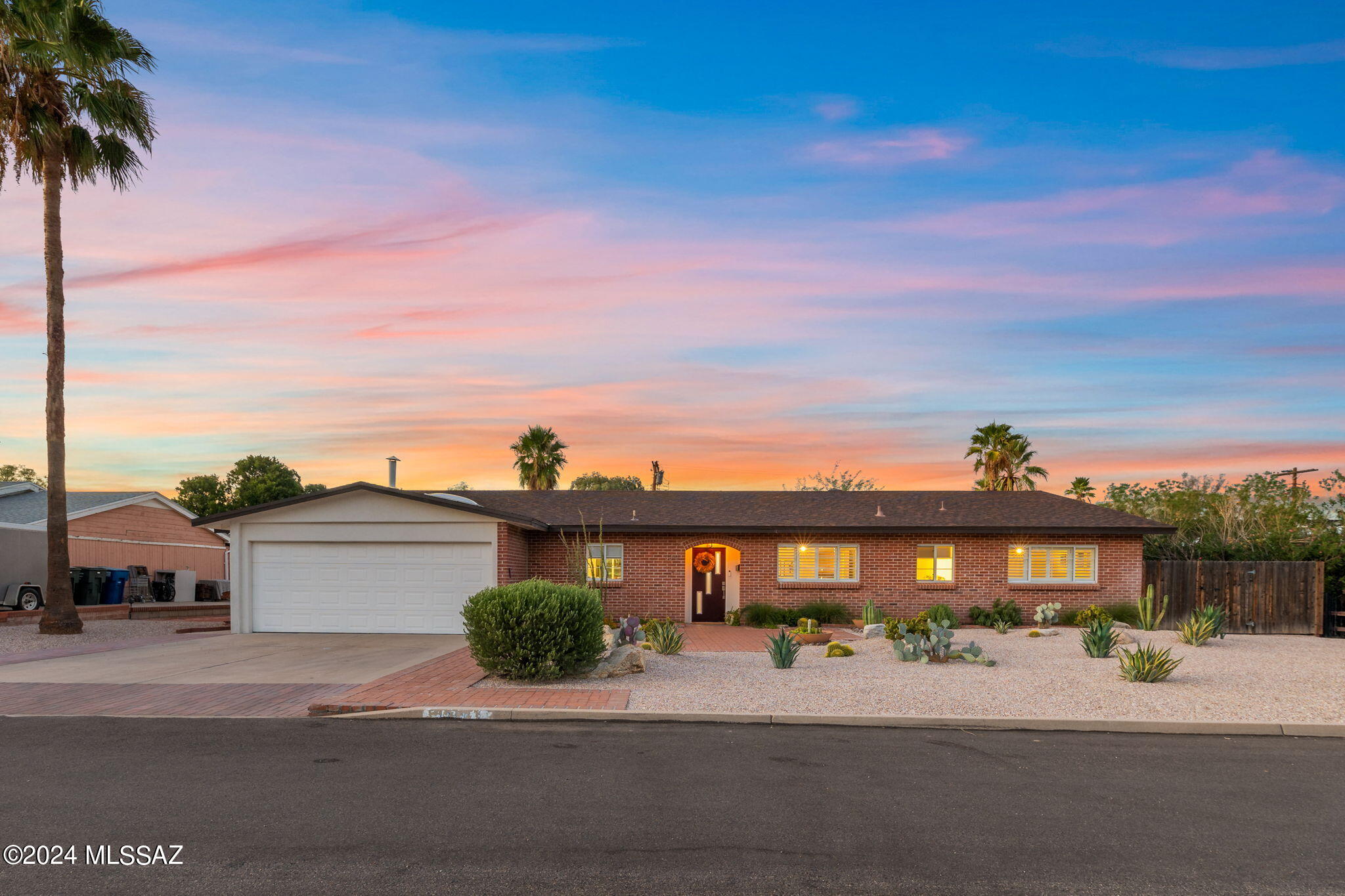 OPEN HOUSE SATURDAY 1-4pm!!! Welcome to the perfect blend of charm and distinctly Tucson construction with the bespoke touches and style for modern living! Welcome Home! This stunning example of pride of ownership and refined elegance is ready for you! Located in the highly esteemed midtown neighborhood of Miramonte, you feel a world away and yet are truly in the center of it all (mere moments to Whole Foods, Barrio Bread, Himmel Park, Floras Market, Modern Street Car). Arrive to curb appeal galore with exquisitely manicured front landscaping and step inside to the warmth of home further elevated with designer touches and bespoke refinements! The living room is adorned with signature beam ceilings, bamboo wood flooring, and natural light galore via the large picture windows! (continued) The chefs kitchen will impress even the most discerning epicurean. With quartz countertops, custom cabinetry, designer appliances, and farm sink, kitchen bliss abounds! Imagine hosting family and friends in this refined and functional space. This split floorplan home allows space for all with two primary suites located on either side of the home. The west primary is expansive, private, and includes spa like bathroom with walk in shower and custom tile work! The east primary suite is spacious, overlooks the peace of the sizeable backyard, and includes a bathroom which is truly an oasis within an oasis! The guest suites are adjacent to the east primary and provide space and privacy for all. Even more, the guest house wows with authentic touches and undeniable charm! This space is perfect for hosting friends, family, or even a possible rental with separate access. The backyard is ultimately private with mature landscaping and low care, automatic irrigation setup. Don't miss the new roof, new sewer lines (huge for this neighborhood), new HVAC in main home, Hunter Douglass shutters, new washer/dryer, new dishwasher, drip irrigation, updated lighting package, paver driveway expansion, and so much more! Distinguished design and custom features abound in this midtown masterpiece! Don't miss this one-of-a kind opportunity!
