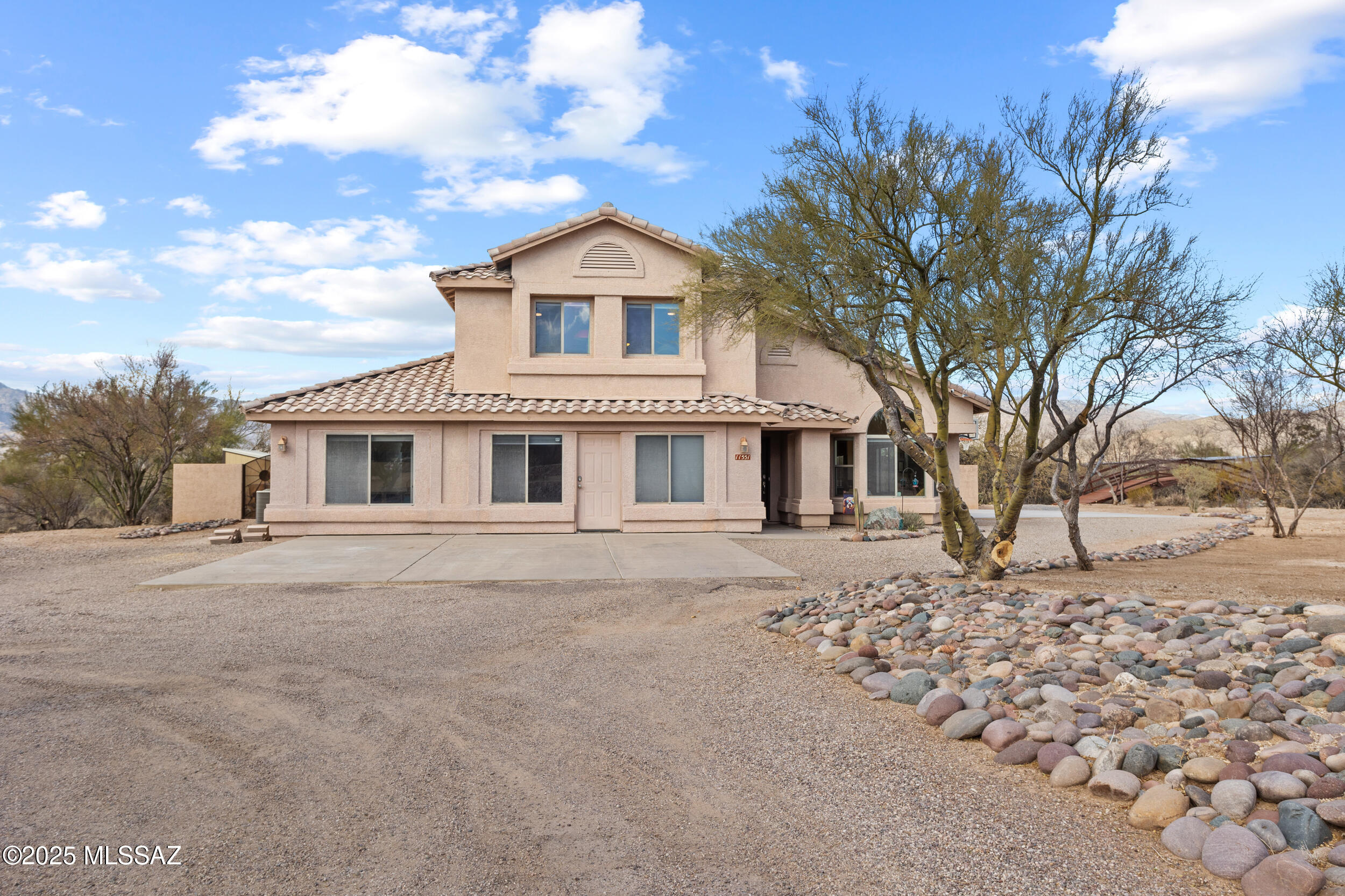 Range priced- seller will accept/counter offer within the range of $750,000-$825,000. Sweeping Catalina Mountain Views from a Spacious 5BR/3BA Home on 3.3 Acres!
Experience breathtaking mountain views in this expansive home. It features Brazilian cherry laminate wood floors, an updated kitchen with wooden cabinetry, a double oven, and a charming bay breakfast nook overlooking the backyard and mountains. The primary bedroom upstairs features stunning sunsets from the balcony. Designed for both comfort and functionality, this home boasts a large family room with a striking stacked-stone fireplace, as well as a formal living and dining room off the foyer. The open, contemporary design is filled with natural light. The first floor includes a bedroom, full bath, recreation room, and two small rooms/offices, perfect for a home business or a remote work setup.
Step outside to a beautifully landscaped backyard with unobstructed Catalina Mountain views, featuring low-maintenance turf and decorative rock for a peaceful retreat. To the east, a bridge leads to the horse facilities, including a corral, round pen, covered stalls, and a barn shed for a tack room.
This unsubdivided property offers ample space to bring your RV, toys, and horses, making it an ideal haven for outdoor enthusiasts.

Owned solar keeps their electric bill low. They have due credit!