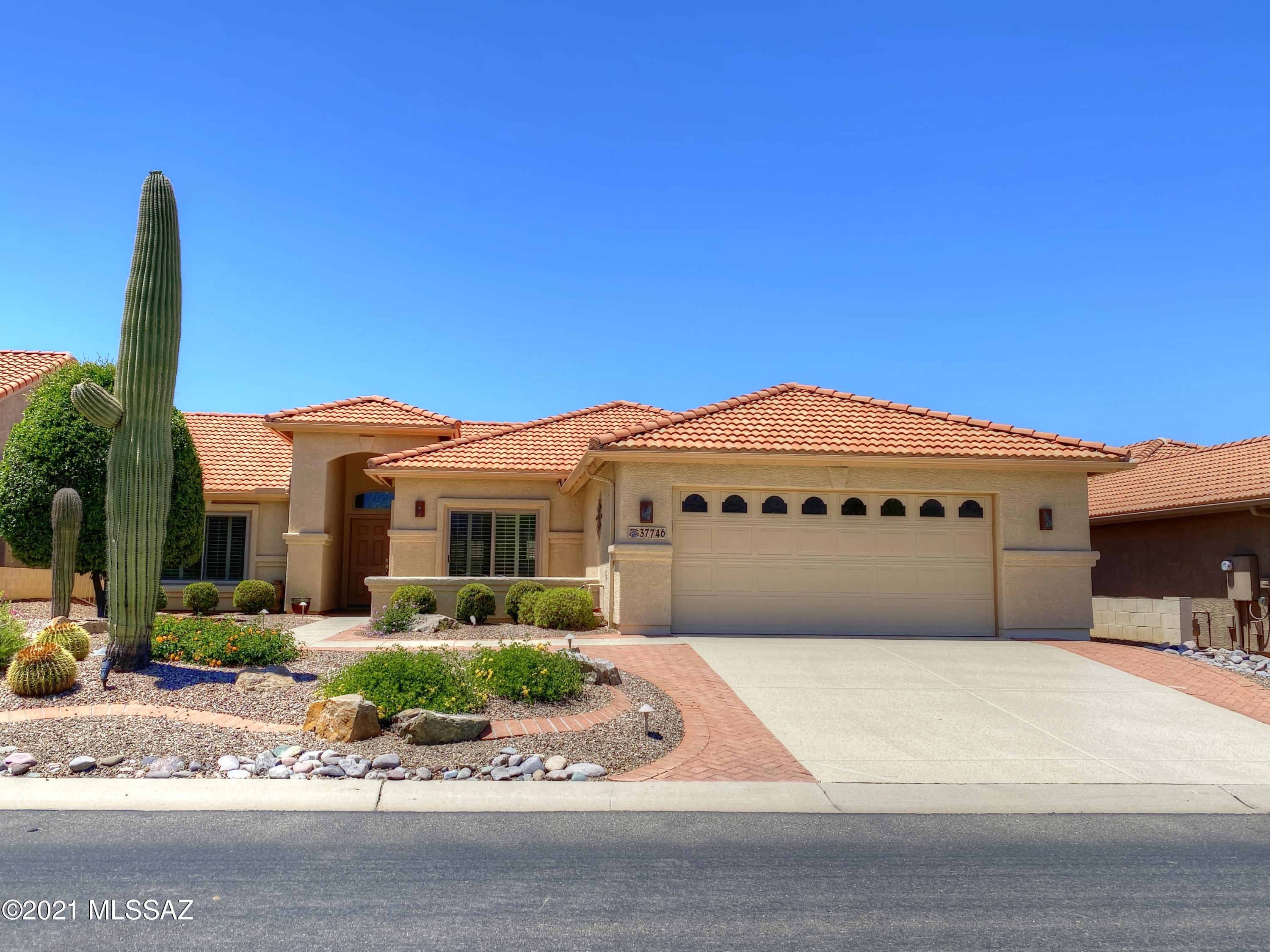 This beautiful Laredo on the golf course is being offered completely ''turn key'' including the golf cart. Immaculately maintained by seasonal owner. Lovely interior has tile floors, plantation shutters, new vinyl windows in most rooms and the kitchen sliding door, ceiling fans and extra lighting. Furnace replaced in 2015, water heater replaced in 2014. Full covered patio has rolling shutters, stamped concrete floors, ceiling fans and rope lighting. Set on the Mountain View  Golf Course with expansive views. Artificial turf  putting green and extended patio. Replaced irrigation system. Garage is extended 8 ft, with epoxy coated floor, built-in storage & work/tool station. Soft water system and R/O system under kitchen sink. Easy living, just move right in and start enjoying the good life.