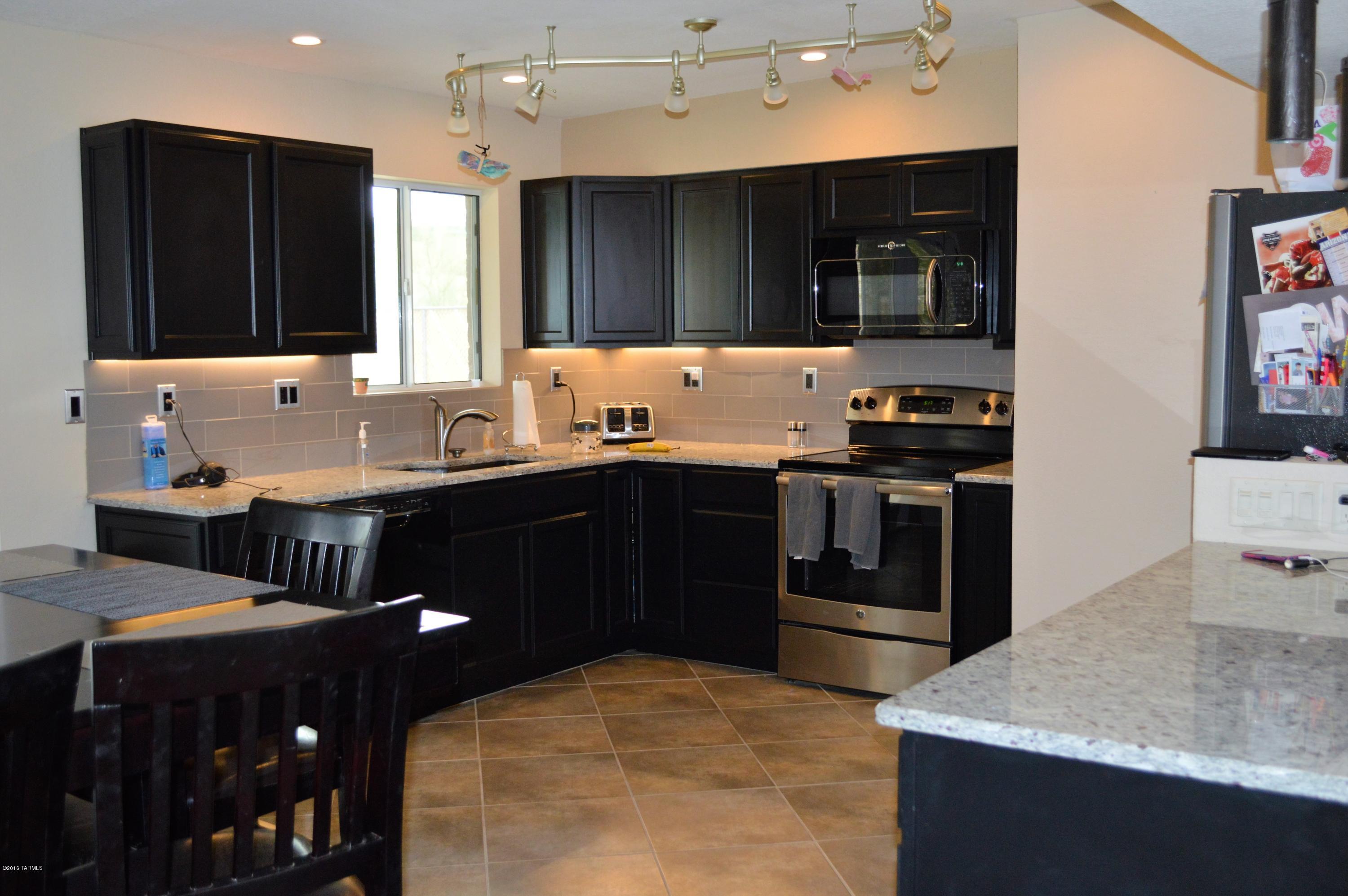 Here's a WIN WIN...  With an acceptable offer, the Sellers are willing to contribute up to 3% towards Buyers closing costs  or installation of a carport!  Beautifully updated 3 BR 2 BA home located in a quiet, convenient neighborhood.  This home features newer tile floors and updated kitchen with newer lighting.  Looking for a great starter home you can walk into?!  Come make this house your  new home!  You will not be disappointed....MUST SEE!