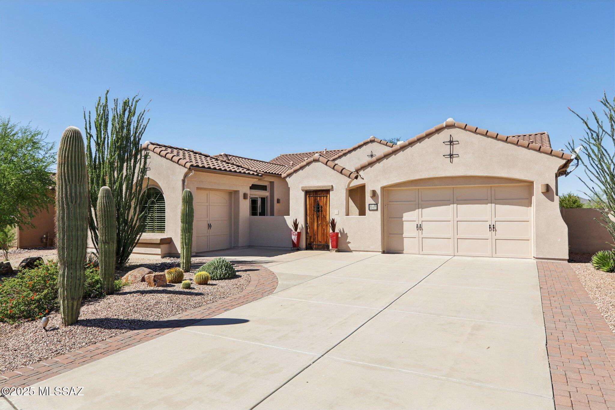 This gorgeous home is located in the small gated community of Siena in Oro Valley close to highly rated schools, golf, parks, and shopping. You are immediately greeted by a large private courtyard to welcome family and friends, positioned for views of sunrise over the Catalina Mountains.  Once you enter the front door you have an expansive view to a very private lot backing to a wash, with unobstructed views of the Tortolita and Tucson Mountains, and vivid sunsets. Home features 3 bed+office, 2 bath plus separate 1 bed/1 bath guest casita with its own entrance, ideal for hosting guests, a private office or gym, or a mother-in-law suite. This home was built for entertaining with a large open great room, 12' ceilings, oversized picture windows, gas fireplace with stone surround, built-in shelves, 24" tile throughout main areas- living and dining area, breakfast nook and spacious kitchen.  Kitchen includes cherry cabinets, s/s appliances including 5 burner gas cooktop, double ovens, granite countertops, large walk-in pantry and a sit-up bar making it the perfect place for anyone who loves to cook. Oversized primary includes en-suite bath with two walk-in closets, dual vanities, large soaking tub and separate shower. The backyard features a covered brick patio, large tree for shade, fire pit, citrus trees, and mature flowering bushes. Patio has electric sunshades and overhead fans for year-round enjoyment.  Freshly painted exterior, 2 and 1 car garages with overhead storage, energy efficient insulation, 2 newer HVACs Dec 2024, and  hot water heater in 2021 are just a few of the additional bonuses.  Extensive features list attached.  This home is perfection and not to be missed.