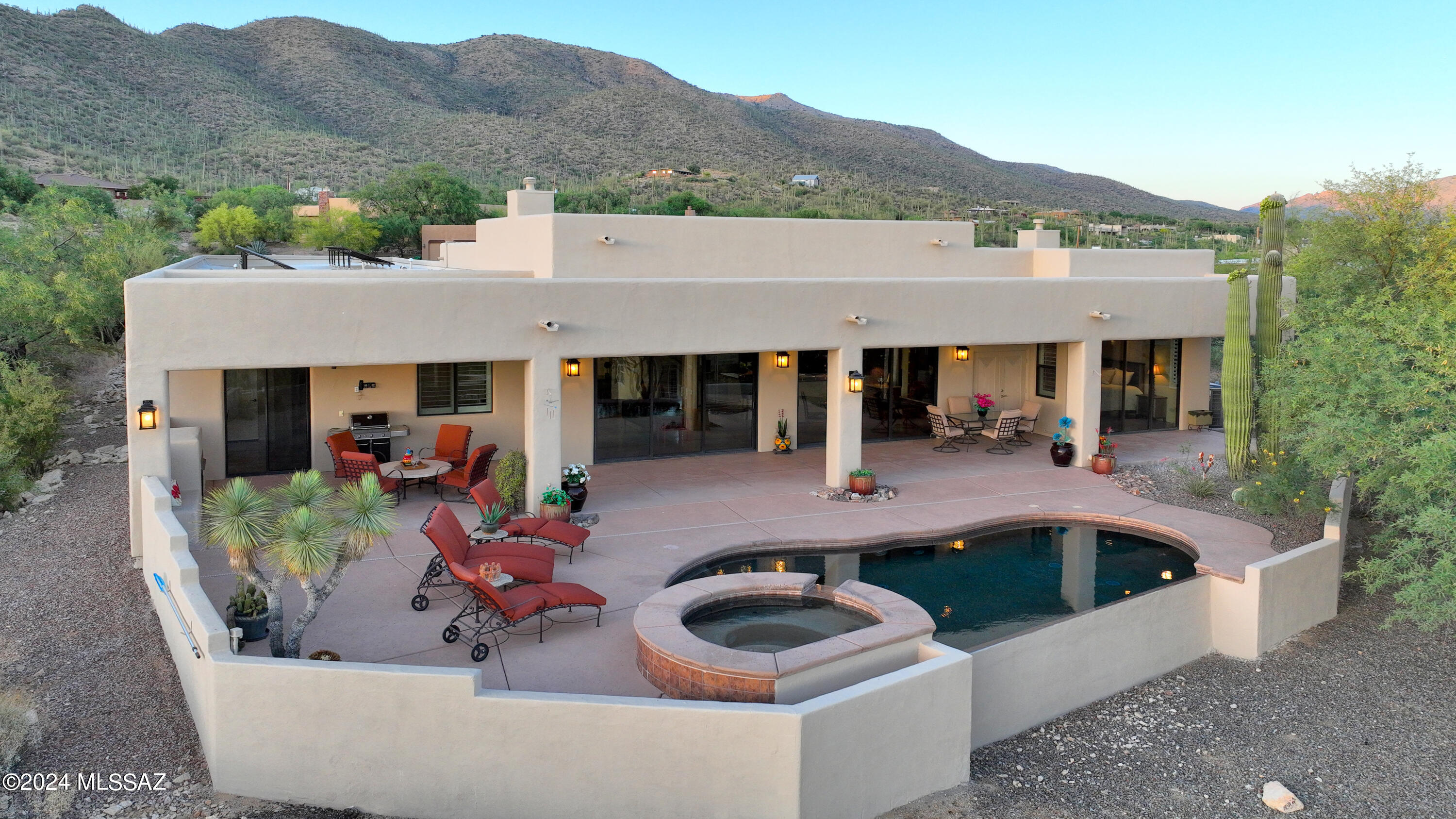 Welcome to luxury living in gated Sabino Highlands! Enjoy spectacular mountain & Tucson city light views from this .93-acre elevated lot. With an owned Tesla Solar System, circular paver driveway, and new exterior lighting, sustainability & curb appeal are ensured. This 3,224 sq ft home features scored concrete floors, surround sound, & a cozy gas fireplace. Gourmet kitchen boasts granite countertops, Monogram appliances, & walk-in pantry. Retreat to the primary suite with double-sided fireplace, granite countertops, and jetted tub. Relax in the saltwater infinity pool/spa or entertain on the 900 sq ft patio with outdoor fireplace & BBQ grill. Additional features include a 3-car garage & 10-camera security system. Experience the ultimate Arizona lifestyle in this impeccably designed home! This Home is the epitome of luxury living within the gated Sabino Highlands Subdivision! Situated on a .93-acre elevated lot, this exquisite property offers awe-inspiring views of the majestic mountains and the twinkling Tucson city lights. Boasting many high-end features, this home is truly a masterpiece of modern comfort and elegance.
Step inside to discover a spacious 3,224 square foot split-bedroom floor plan, with scored concrete floors and surround sound system. The inviting ambiance is further enhanced by the dramatic city light views from the family room with a cozy gas fireplace.
The heart of this home is its gourmet chef's kitchen, equipped with granite countertops, cherry cabinets, and top-of-the-line Monogram stainless steel appliances. The kitchen also features a large island, breakfast bar, and a convenient walk-in pantry, providing ample space for culinary enthusiasts to indulge in their passion.
Retreat to the luxurious primary suite, where a double-sided fireplace sets the tone for relaxation. The primary en suite bathroom boasts granite countertops, dual vanities, a jetted tub, and a large walk-in shower with remarkable tile surround. Two spacious walk-in closets provide ample storage space.
Outside, the expansive 900 square foot patio beckons for outdoor entertaining or quiet moments of relaxation by the saltwater infinity pool/spa. Enjoy the convenience of a BBQ grill connected to natural gas as you relax and take in the breathtaking views.
Additional highlights of this remarkable property include: an owned Tesla Solar Electric System with 3 Tesla Battery Powerwall, ensuring energy efficiency and sustainability for years to come, a circular paver driveway with new solar lights, new exterior lighting, and three new exterior ceiling fans. The three-car garage features epoxy floors, a mini-split, and a sink. For added security and peace of mind, the home has a security system with ten cameras and comes with a termite warranty.
With its impeccable design, luxurious amenities, and unparalleled views, this home offers the ultimate Arizona living experience. Don't miss your chance to call this prestigious property yours!

THE PROPERTY
Gated Sabino Highlands Subdivision
Spectacular View of Mountains and Tucson City Lights
.93 Acre Elevated Lot
Owned Tesla Solar Electric System with Tesla Powerwall
Circular Paver Driveway with New Solar Lights
New Exterior Lighting and 3 New Exterior Ceiling Fans
Saltwater Infinity Pool/Spa with Wifi and Variable Speed Pump
900 Square Foot Patio and Outdoor Fireplace
BBQ Grill connected to Natural Gas
3-Car Garage with Epoxy Floors, Mini Split, and Sink
Security System - With 10 Cameras
Termite Warranty

THE HOME 
3,224 Square Feet
4 Bedrooms and 3 Bathrooms
Split Bedroom Floor Plan
Front Courtyard
Double Door Entry
Scored Concrete Floors
Surround Sound in Most Rooms
Gas Fireplace in Family Room
Whole House Humidifier
Central Vacuum
Kinetico Water Softener
Williamson & Sons HVAC
2 Rheem gas, fiberglass Water Heaters
2 Variable Speed Heat Pumps
Roof Coated in 2021

IN THE KITCHEN  
Gourmet/Chef's Kitchen
Granite Countertops 
Large Island and Breakfast Bar
Cherry Cabinets
Bosch Dishwasher
Monogram Stainless Steel Appliances
Warming Drawer Under Oven
Gas Cook Top with 4 Burners and Griddle
Hot Water Pot Filler Faucet
Walk-In Pantry
Formal Dining and Breakfast Area

MASTER SUITE / EN SUITE BATHROOM
Double-Sided Fireplace
Granite Countertops
Dual Vanities
2 Walk-in Closets
Jetted Tub
Large Walk-in Shower
Luxurious Tile Surround