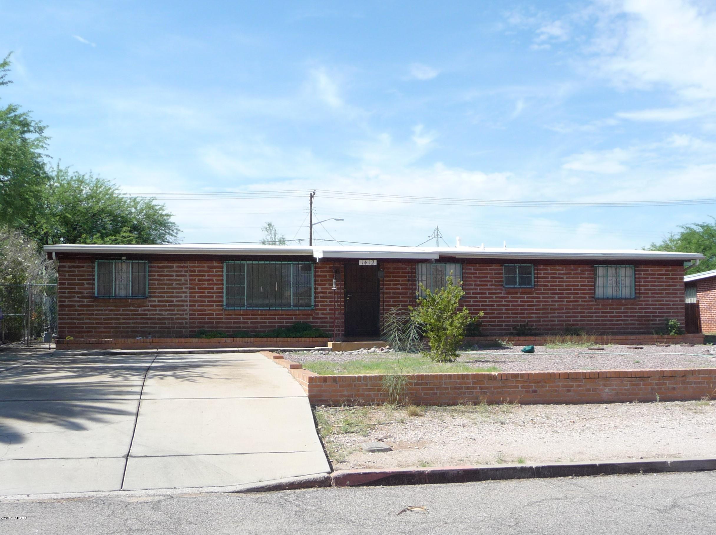 Great Central Tucson Location in Jefferson Park Addition. Convenient to Shopping, Minutes away from UA. This 3 Bedroom 2 Bath Burnt Adobe Charmer sits on a large lot (75X150). There is an Extra Room at the East End of the Home that has many possibilities as a Home Office, Recreation Room, etc. There is a separate 2 Car Garage with an Extra Room for workshop, hobbies, etc. Home is ready for your updating touches. Exterior Laundry connections may possibly be moved in the Extra East End Room Closet Area. Property being sold As Is.
