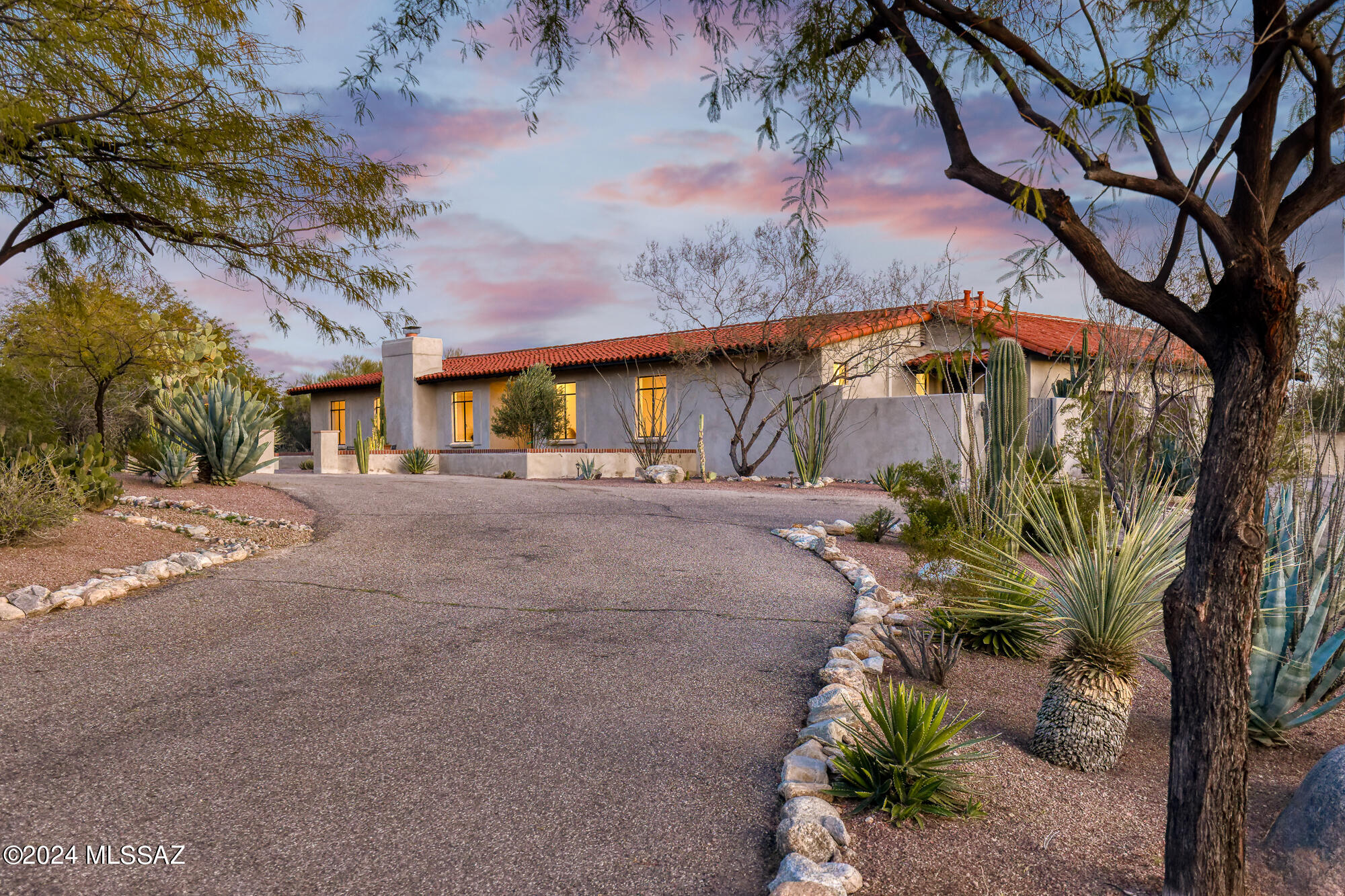 Nestled amidst the captivating beauty of the Catalina Foothills, this refined adobe residence offers a serene retreat with breathtaking city and mountain views. Set on over an acre of lush landscape, this private sanctuary exudes warmth and sophistication.

Step inside to discover a tastefully renovated interior, seamlessly blending timeless elegance with contemporary allure. Natural light pours through the expansive windows and glass doors, the space showcases exquisite craftsmanship and luxurious finishes, creating an inviting atmosphere for both relaxation and entertainment.

Outside, glass French doors open onto meticulously landscaped grounds, expansive patios, and a sleek ebony pool— a serene oasis against the backdrop of the desert panorama, perfect for outdoor gatherings or quiet moments of reflection.

Don't miss this exclusive opportunity to own a piece of desert paradise, conveniently located within the sought-after District 16 school district. This area boasts many of the city's upscale shopping boutiques, fine dining, art galleries, major resorts, country clubs, top-rated schools, world-class golf, tennis, and hiking trails. 

Schedule your private viewing today and experience the beauty of desert living in style.

List of upgrades and floor plan available under documents or upon request.