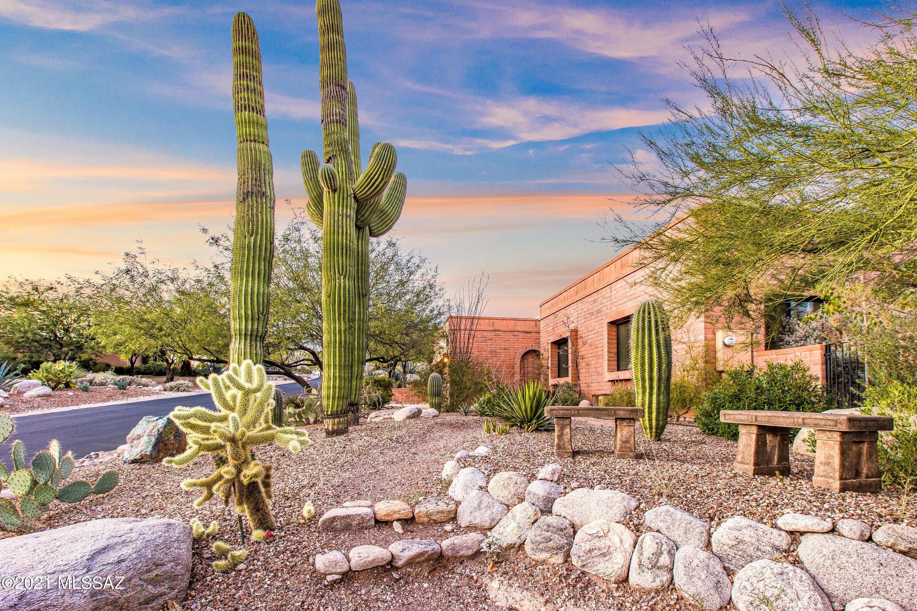 Spectacular Territorial style 3 bed home perched high on a 1 Acre ridgetop lot on a quiet cul-de-sac in the Catalina Foothills w/ magnificent sunrise, desert & mountain views. High end renovation features wide plank weathered oak floors, kitchen w/ leathered finish chiseled edge granite counters, solid maple soft close cabinets, under/above cabinet lighting & Stainless Steel Kitchen Aide appliance suite w/ 5 burner gas cook top. Ample living/kitchen/dining space & sliding glass doors provide direct access to the expansive covered patio & professionally landscaped low care yard. Enjoy soaring ceilings, a fireplace & walls of picture windows. Restaurants, shopping, hiking & world class golf nearby. Community Jr. Olympic pool/spa & tennis. Move in & enjoy the best of Tucson Foothills living!