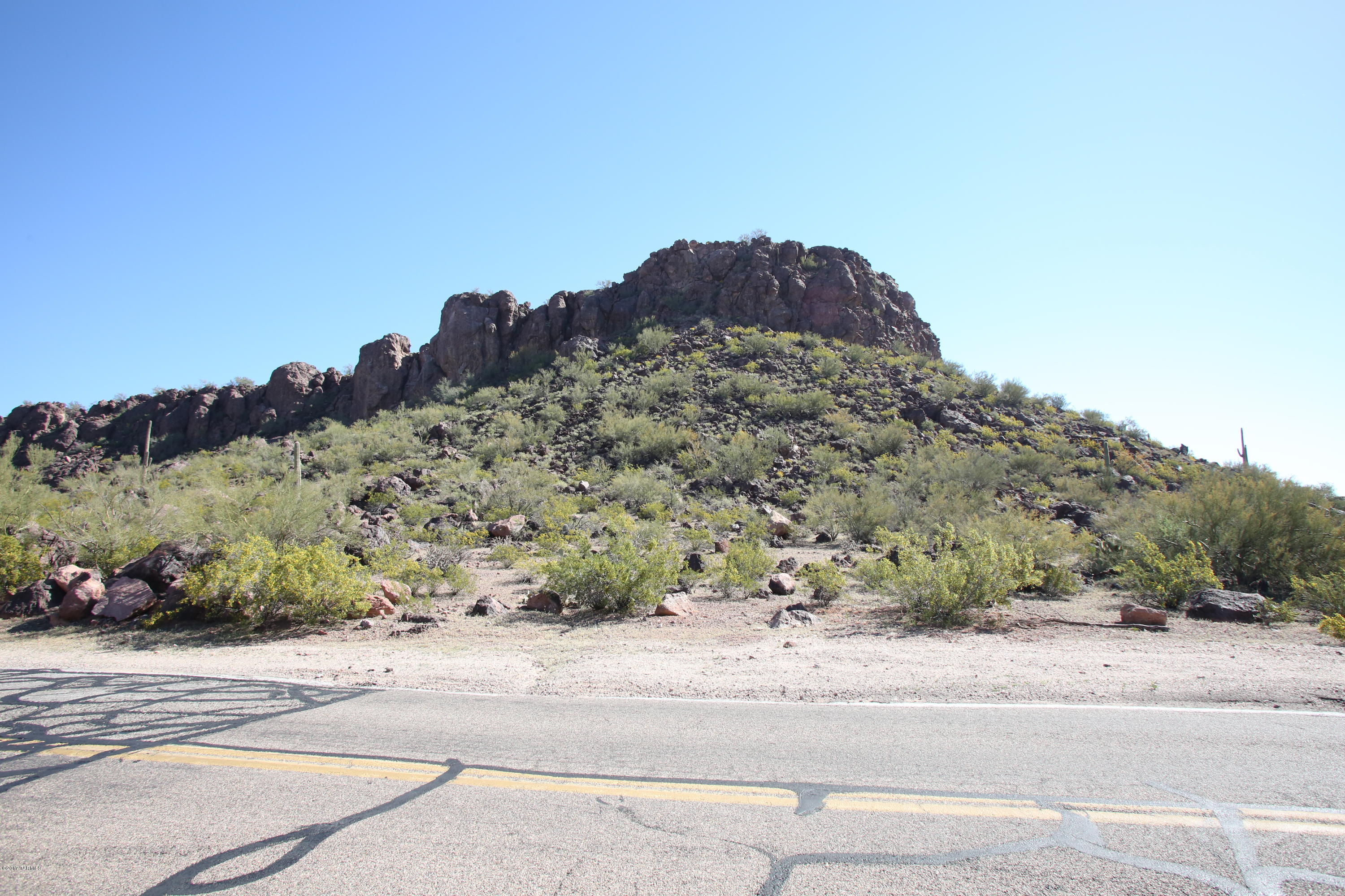 Have you ever wanted to own a small mountain? Here is your chance to do so! Build a master piece on 13 acres overlooking the Old Pueblo! All offers will be entertained.