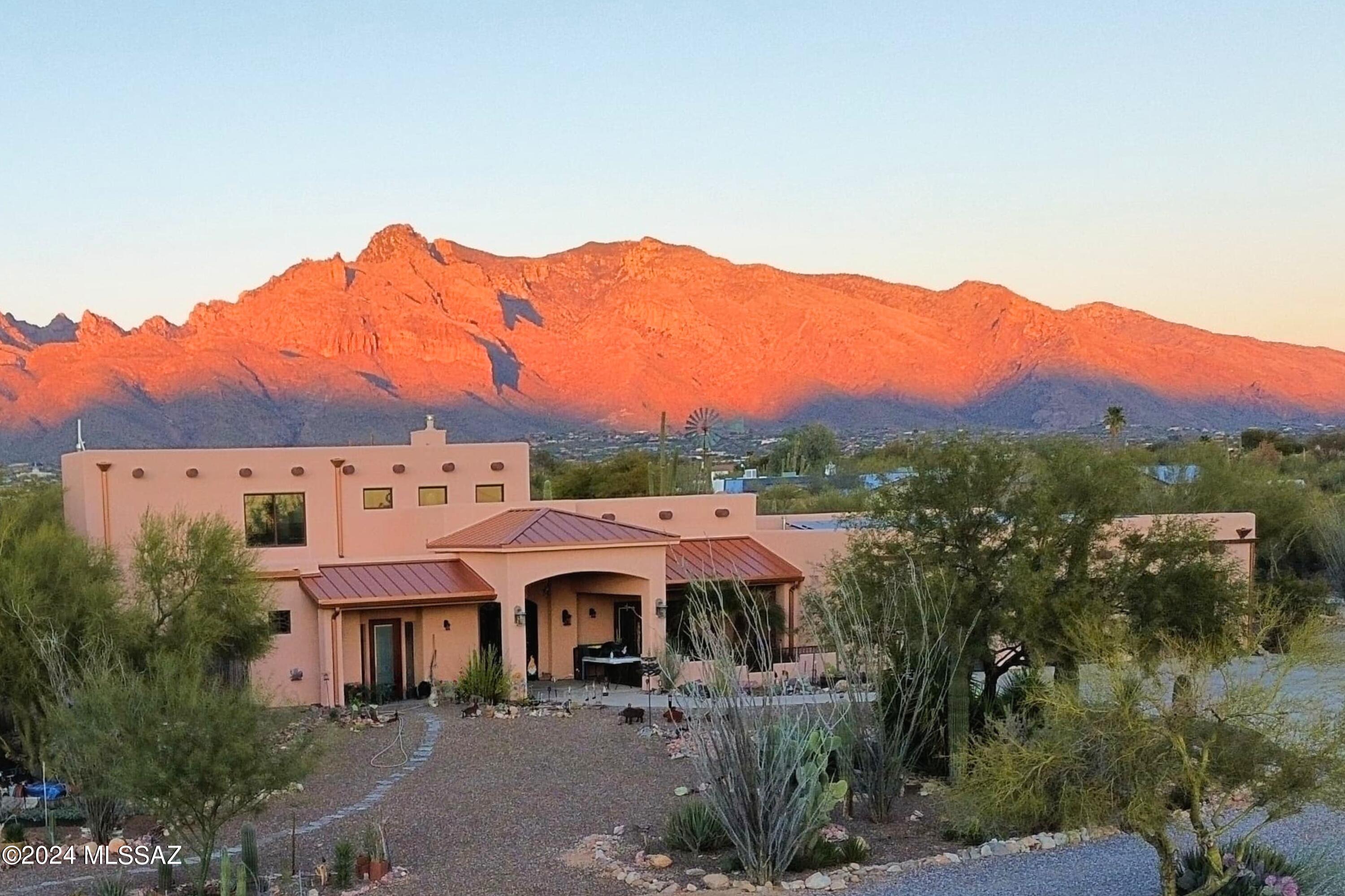 Experience the Southwest desert lifestyle in a location that perfectly combines a spectacular ambiance w/ proximity to shopping, restaurants, hospitals, the loop & more. Unique & marvelous compound of 3 homes & workshop on nearly 7-acres of paradise that offers peace & quiet w/ stunning mountain views & breathtaking sunsets. The ideal balance of privacy and multi-generational living. The residence at 111 Rudasill is an architectural masterpiece w/custom designs, luxury features & wheelchair accessible. The historic 101 Casita features authentic paintings by renowned artist Ted De Grazia & the Herbert's historic house is featured in many articles and magazines. Art, history, rock sculptures & luxury make it the perfect place to unwind & enjoy the good life!  No HOA Seller will accept or counter offers bewtween $2'100,000-2'000,000 million  ***Three separate houses on two parcels offered together. The total of 9496 Sq.Ft. under roof construction includes: A luxury newer house built in 2013 sitting on 4.92 acres AND two historic homes built in the 1940's on 2 acres along with the 1900sf workshop w/attached RV covered parking & hook ups.  The seller shares the history of each home, be sure to read the  "Property History -Narrative" in the attached documents.  For additional pictures and details view each listing; 101 E. Rudasill RD, MLS#22400963 and 111 E. Rudasill Rd, MLS#22400964.