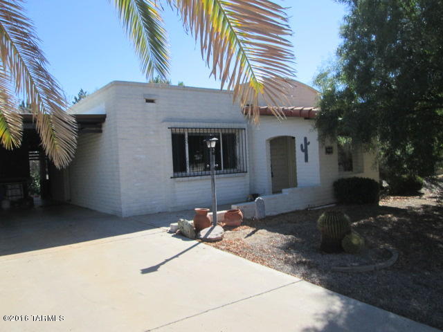 This charming home is turn key, Updated home in Desert Meadows. Great tile throughout! Updated bathrooms and kitchen. New, dual pane windows and patio slider that leads into AZ room overlooking large, private, lush, oasis that awaits you in the backyard, with mature trees. Assumable FHA loan. Most of the furniture will stay with accepted offer. Don't miss this adorable home!