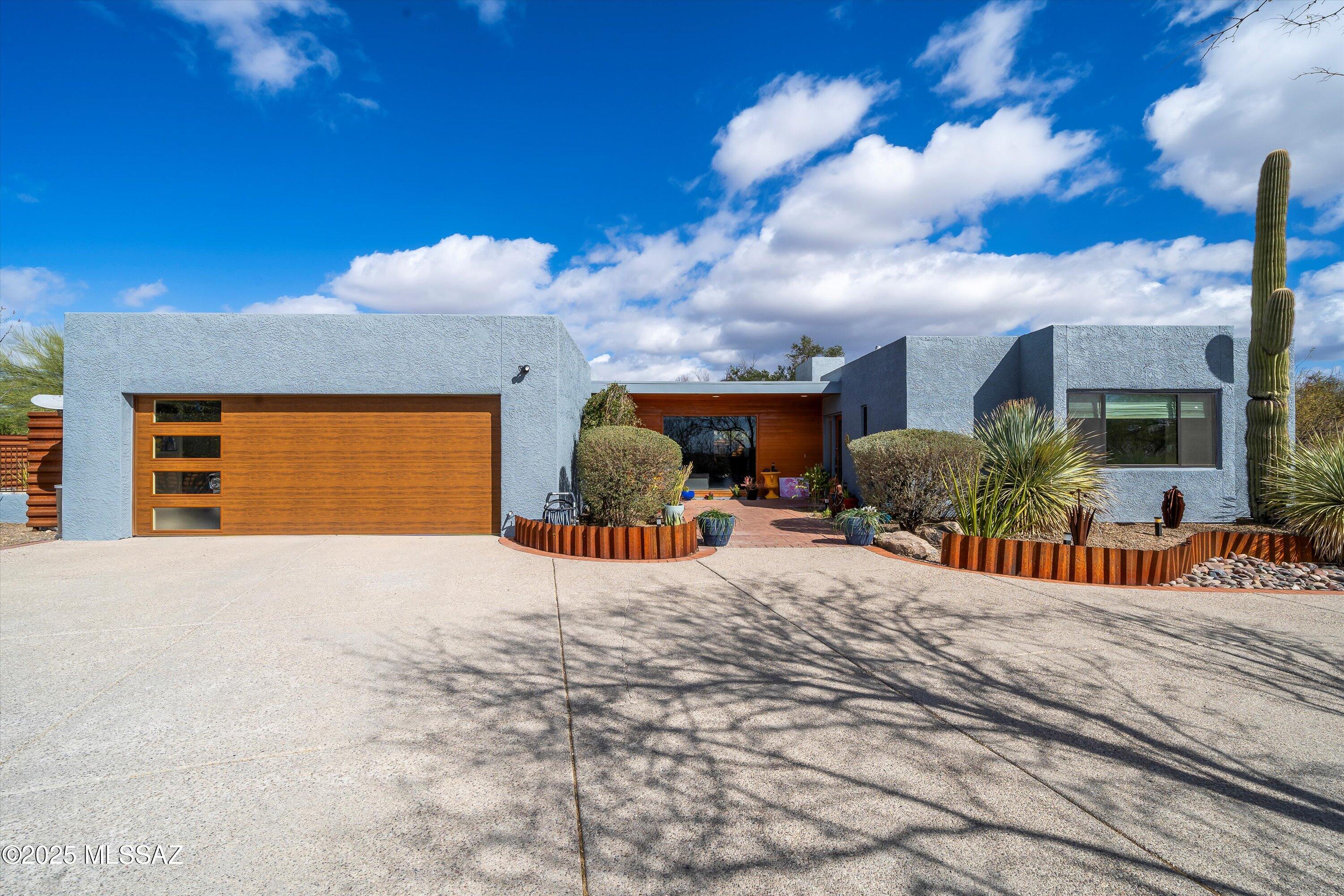 Nestled in the highly sought-after Tucson Foothills, this beautifully updated 4-bedroom, 3-bathroom home offers a serene retreat with modern luxury. Thoughtfully designed, the residence boasts multiple sophisticated living spaces and an abundance of natural light, thanks to 30 newer skylights and updated picturesque windows and frames.
Step outside to a refreshing, private pool with new tile, re-plastered surface, and updated decking, perfect for relaxation or entertaining. The home has been meticulously improved with renovated living and dining areas, upgraded bathrooms, a newer HVAC system, water heater, skylights, garage door, and stunning exterior enhancements including wood-finished patios and rusted corrugated metal fencing.
Ideally located near The Loop, Alvernon bike trails, the JCC, and Brandi-Fenton Park, this home offers both tranquility and easy access to the best of Tucson's outdoor lifestyle. Don't miss this exceptional opportunity to experience elevated Foothills living!