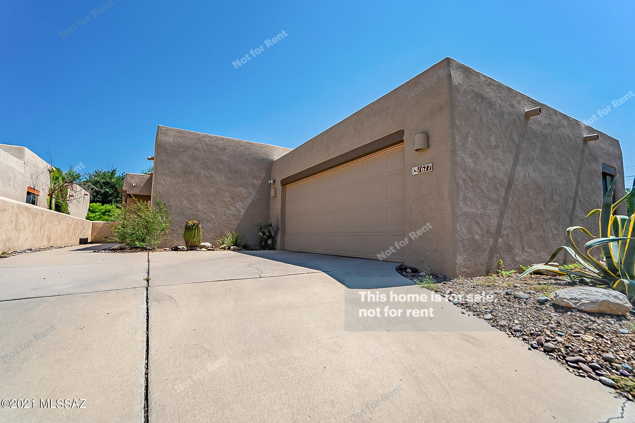 This Tucson one-story home offers a patio, granite countertops, and a two-car garage.