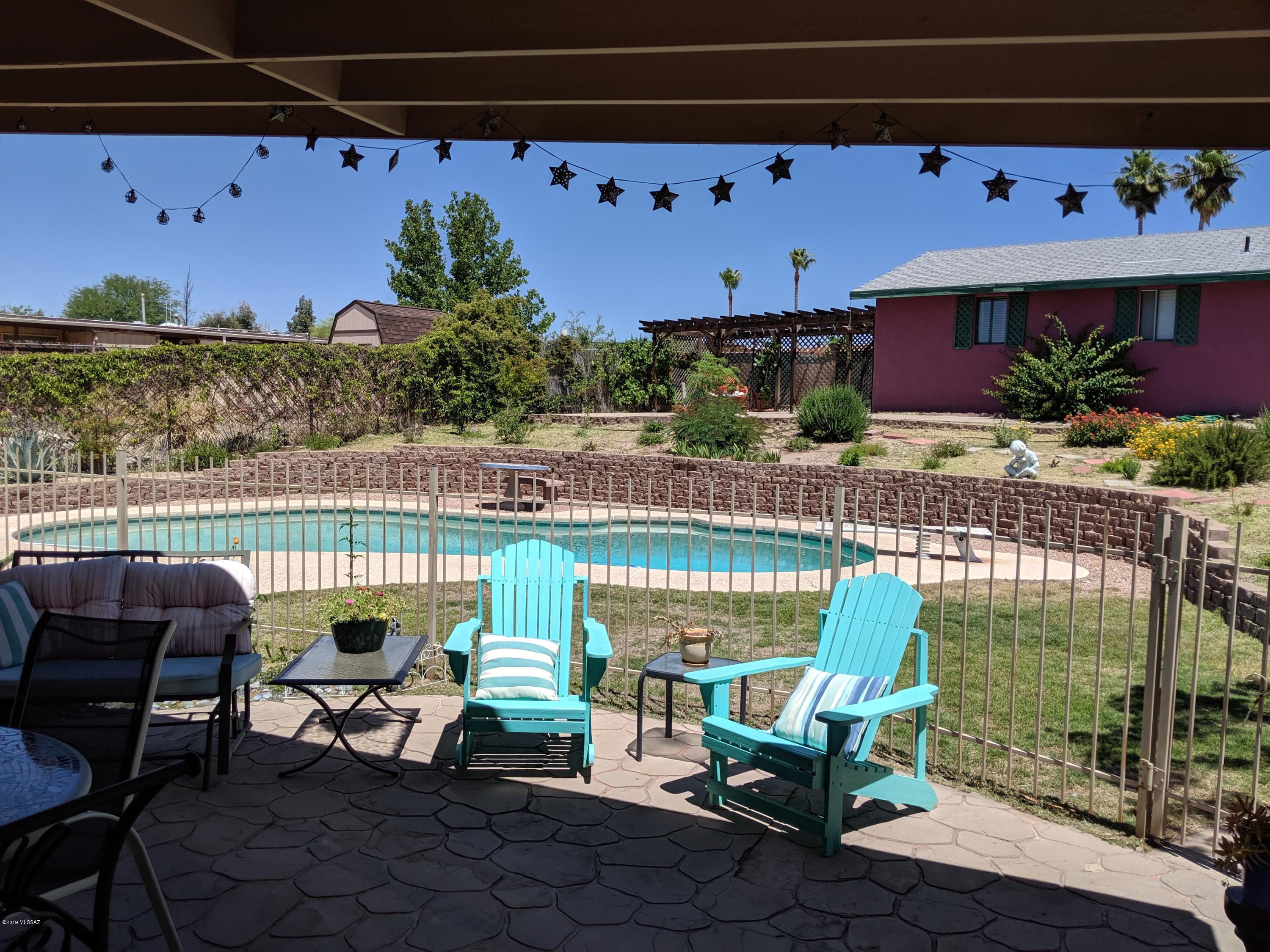 You must come and see this amazing, unique Ranch Style home with super cute Guest House! Features include RV parking, sparkling diving pool and a beautifully updated kitchen with GE Trivection oven, gorgeous cherry custom cabinets w/pull outs, drawers and hidden storage throughout! Stunning granite counters, big windows with tons of light and large kitchen Island! There is an elegant, professionally remodeled master bath, bespoke office space and resort inspired, tastefully designed, back yard retreat all on drip irrigation with beautiful, breathtaking mature vegetation! A 2019 appraisal supports the List Price, so hurry before this one slips away! There is also electrical hook-up for your RV, double gates to back yard and no pesky HOA. Schedule a showing today!