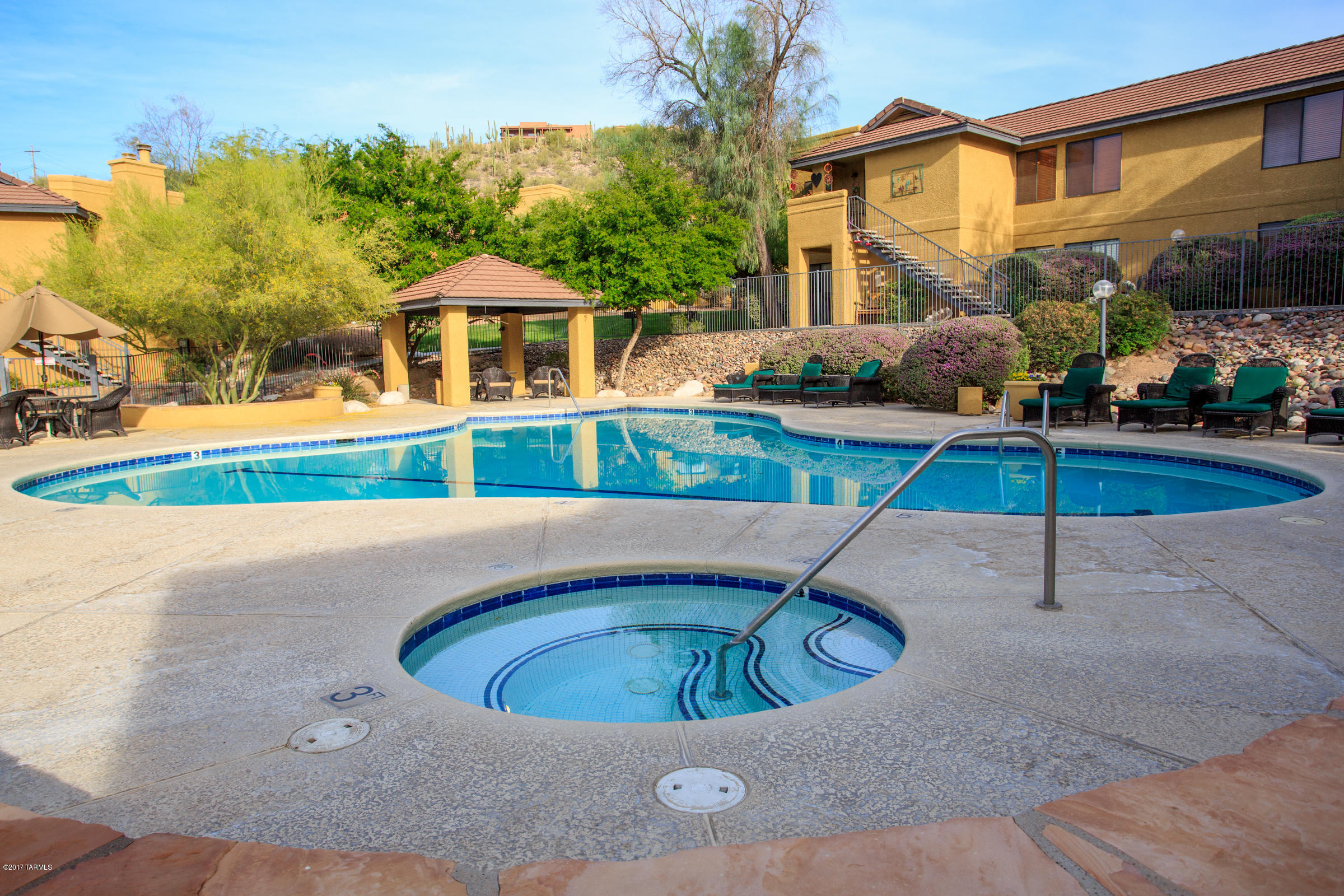 Beautiful Foothills condo with unobstructed mountain views! Three bedrooms and 2 baths with over 1100 square feet! Open great room floorplan with dining area and fireplace! Updated kitchen with cherry cabinets and granite countertops! Hunter ceiling fans throughout! Patio offers storage and incredible mountain views! Lovely gated community with heated pool, spa and exercise room! HOA includes water, sewer, trash services, exterior and roof maintenance, beautiful landscaping, covered parking, security and exterior insurance. Conveniently located close to golf, tennis and hiking! Ventana Canyon shops and restaurants only one mile away and Sabino Canyon only two miles away! Catalina Foothills schools! Call today for your private showing!