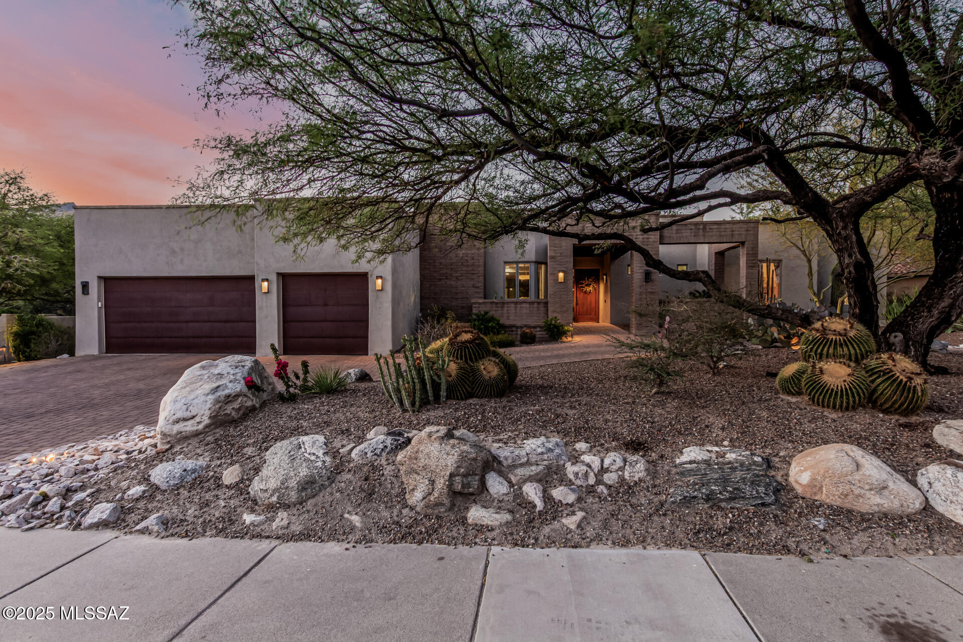 Discover refined desert living in this remodeled 3,891 sq. ft. estate in Tucson's gated Ventana Canyon. On a .7-acre lot with a wrap-around yard, this 4-bedroom, 4.5-bath home backs the 7th fairway, with Catalina Mountain views. Renovated in 2009, the great room features soaring ceilings and large windows. The gourmet kitchen has top-tier appliances, a large concrete island, and granite countertops. The primary suite includes a fireplace, spa-like ensuite, his-and-hers closets with built-in shelving, and patio access. Enjoy a media room, office, and guest quarters with private entrance and patio. The backyard offers a covered patio, BBQ, gas fire pit, and desert landscaping. Ventana Canyon Country Club provides two golf courses, pools, tennis, fitness center, spa, and dining. Near downtown Tucson and Sabino Canyon. Tour today!