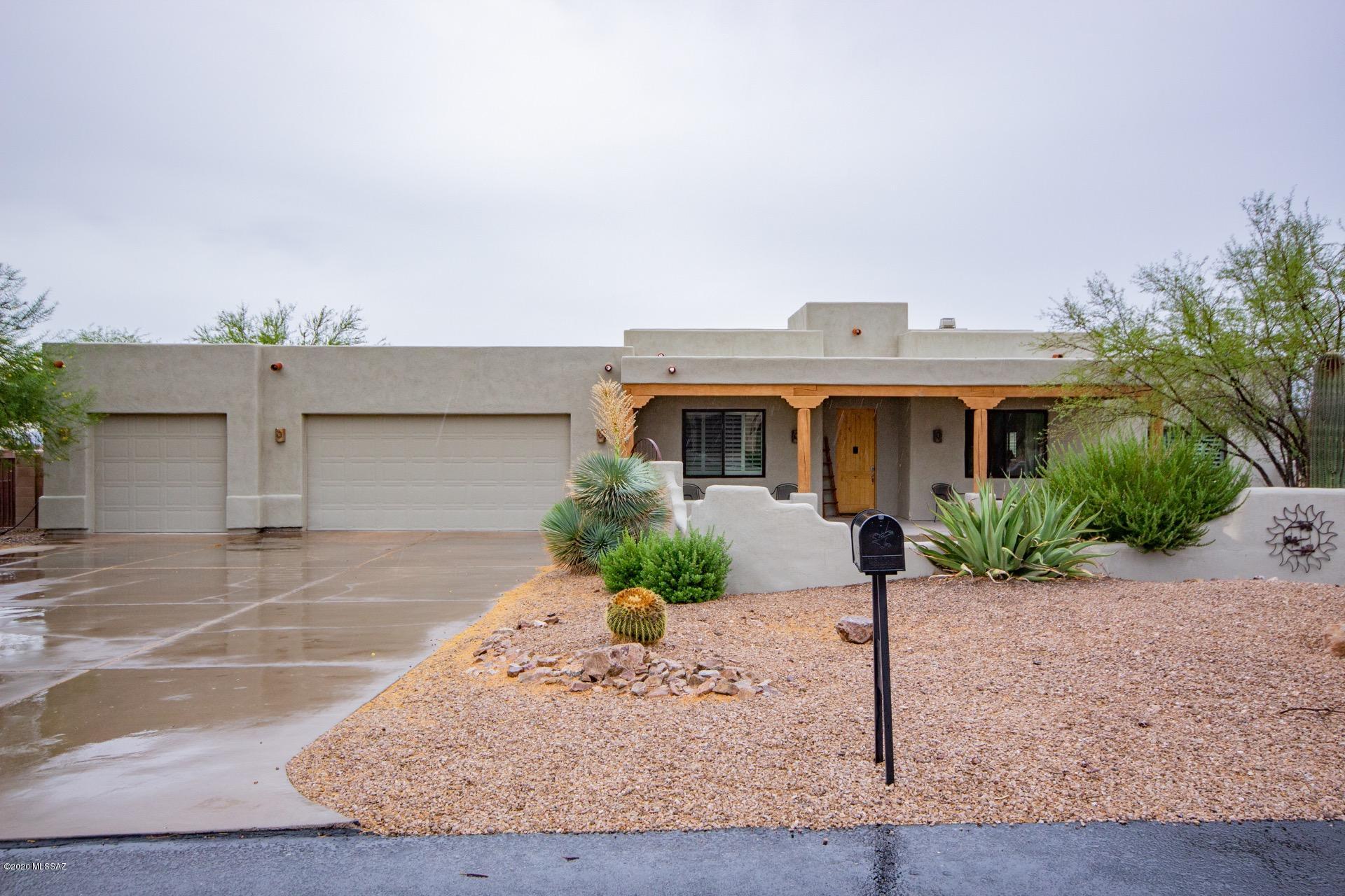 Outstanding Custom Built Southwestern Style Home in the Gated Community of JD Ranch. Breathtaking Mountain Views, sparkling backyard pool, covered patio, & synthetic turf. Plenty of space for ''toys''!  Dramatic wood beamed ceiling in great room, kiva columns, beautiful tiled floors, handsome stone fireplace. ceiling fans, & warm palette. Granite kitchen counters, SS appliances, pantry, breakfast bar, & wood cabinets w/hardware. Formal dining room. Plush carpet in all bedrooms, plantation shutters, ample closets, & 2 upscale baths w/tiled counters. Interior laundry room w/storage cabinets. Private Den or Playroom. Water softener, energy efficient windows, new energy efficient pool pump, and gate to backyard. Do not miss out on this desert gem!