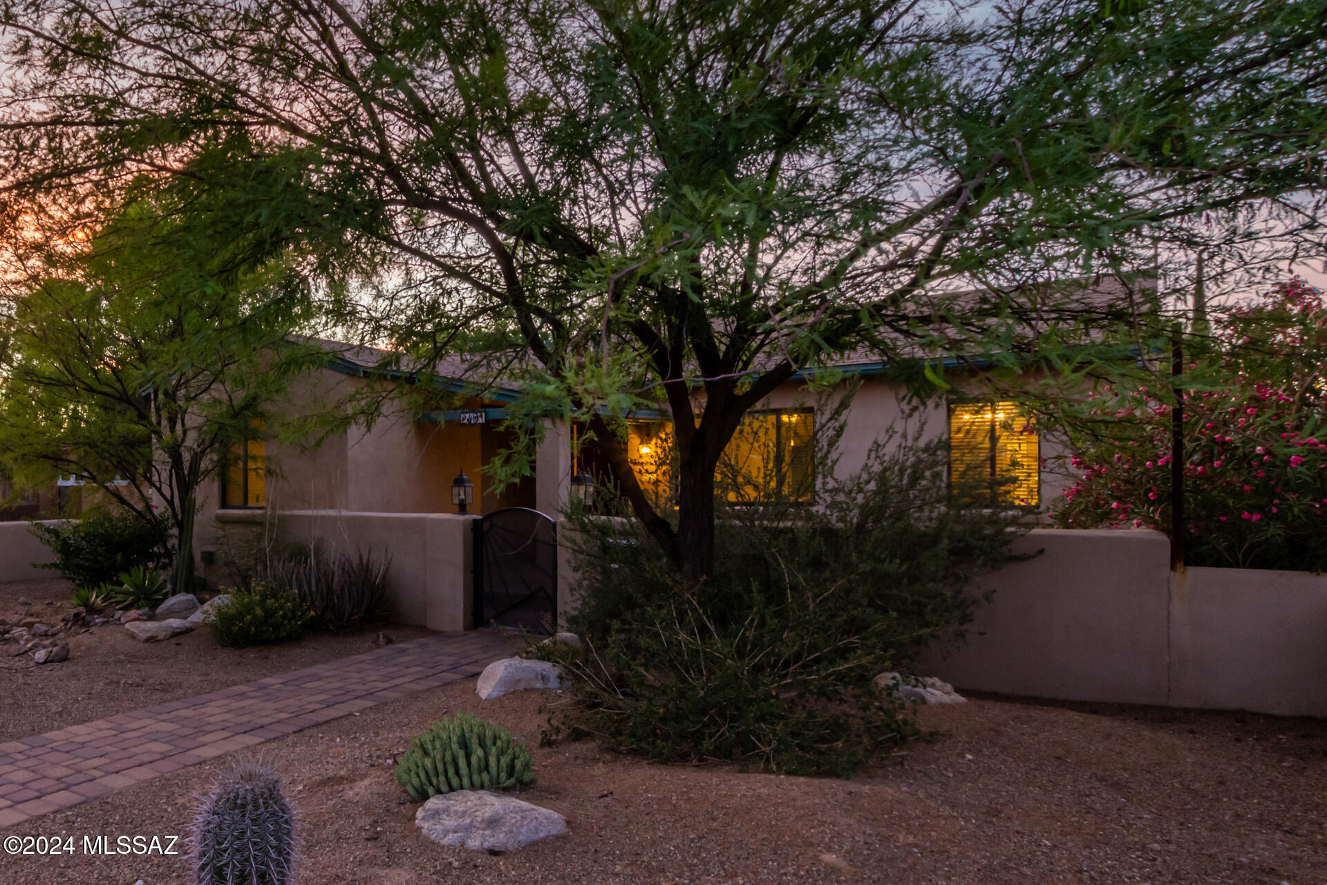 Instant CASHFLOW, beautifully updated, corner lot, sought-after Sam Hughes!(Guest house currently rented for $1,465/mo). A fenced front yard with desert landscaping and a gated courtyard greet you. Inside, an L-shaped great room, original oak wood floors, fresh neutral paint throughout, and abundant natural light awaits. The modern kitchen has cherry cabinets, leathered granite counters, stainless appliances, stylish backsplash, and a breakfast bar. The primary suite features a wood-burning fireplace, backyard access, a private bathroom, and direct laundry room access. Enjoy a paved backyard with a covered patio, mature landscaping, outdoor kitchen w/Ramada, gas fire pit, and 10x20 workshop. Guest house Is has a full kitchen, pendant lighting, open living areas, a bath, and stacked laundry. Both units were recently vacated.This has been a long term student rental for the owners children as they went to the University. Rental demand for this property is high. Previous rents were $2,995/mo for the Main House & the guest house is currently rented for $1,465/mo until March 2025. Tenants paid utilities.