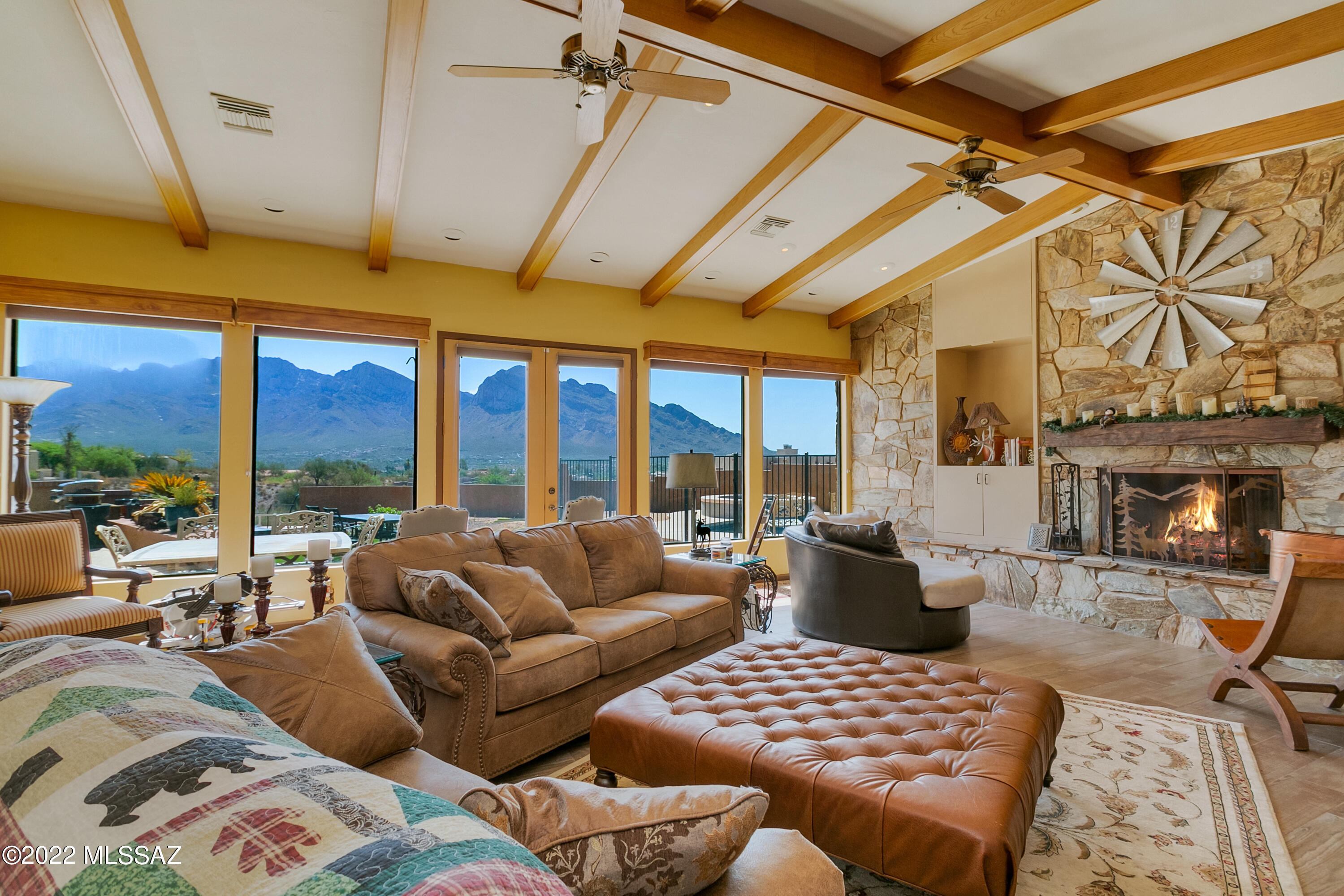 A Million Dollar view is yesterday's news - Here you will truly find TWO MILLION dollar views! Extremely hard to find BUT this could be your lucky day because this home sits on 2 ACRES with 270 degrees of viewing right in the heart of Oro Valley. These are the Special Tucson homes that people search for years for and finally this one is ready for new owners. No previewing is needed; this is a show stopper.  Spectacular high ceilings laid with wood beams greet you in the large Family Room Including walls of windows, stone Fireplace and Wet Bar - these amazing ceilings repeat themselves again in the master suite.  One of the special treats this home offers is no carpeting in any common areas - A MUST for desert living. Seller is a licensed agent in the state of AZ.