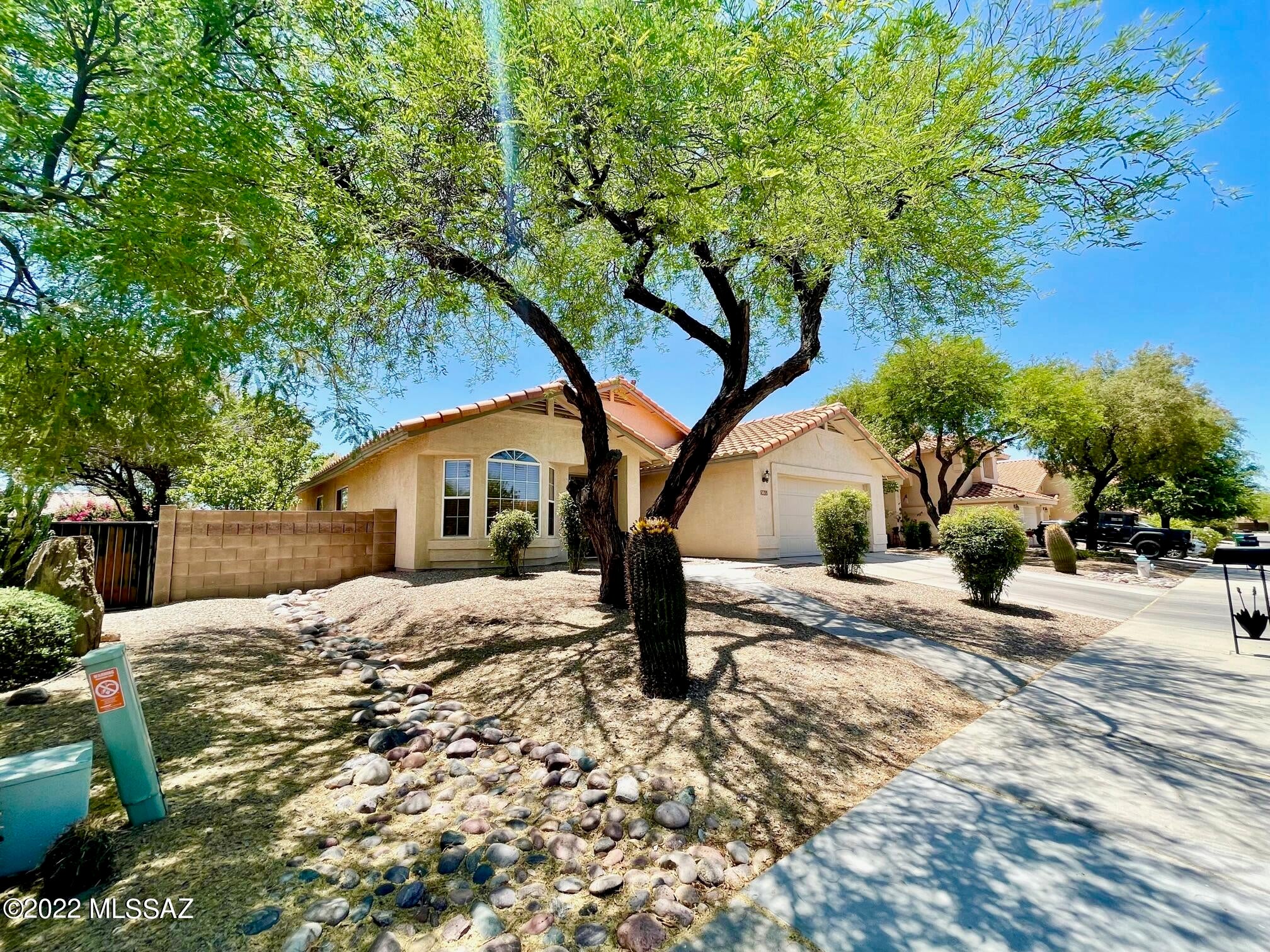 Enjoy the park from the front yard of this 1,937 square foot, 4 bedroom, 2 bathroom home located NW area of Tucson. This home features lots of living space with a great room, family room and kitchen eating area. There a high/vaulted ceilings and hard flooring throughout the home (no carpet). The open concept kitchen features a gas stove, frig, D/W, microwave and center island with breakfast bar seating. Washer/dryer also included. The primary bedroom has a private bathroom with garden tub and a large walk-in closet. The back yard is beautifully landscaped with an expansive brick patio, seat walls, plenty of trees and shrubs to create a park-like setting. This home is available now for a 1 year lease. The rental rate is $2200.00, per month and the security deposit is $3300. If pets are allowed and approved, there is a $25.00 monthly pet fee per pet, plus a $150 non-refundable pet fee, per pet. Pets are subject to owner approval. 2 pets ok.

For REDUCED move-in costs, tenant may choose to pay a non-refundable monthly fee of $58, in lieu of paying the security deposit. If this program is selected, Tenant remains responsible for any damage at the end of the lease term and the sum of the monthly fees will not be credited to any damage amount.

Our residents are automatically enrolled in our Resident Benefits Package. The cost of this program is $29 per month. For more information regarding this program, please go to www.bluefoxproperties.com to the For Residents tab on the banner and click on the Resident Benefits Package on the drop-down menu.

Every adult age 18 and over must complete an application. The application fee is $55 per adult. The application process includes credit, criminal, previous rental history, employment and income verification.

Our minimum rental requirements include the following:
1.The applicants' household verifiable gross monthly income must be 3 times the rental rate. If you are concerned about insufficient income, you may be able to address this concern by adding a cosigner. Contact us for details.
2.All our homes are offered as non-smoking. No smoking is allowed on the premises, inside or outside the home.
3.Reasonable credit. If you are concerned about challenged credit, you may be able to address this concern by adding a cosigner. Contact us for details.
4.We do not accept Section 8.
5.Applicant to provide proof that debts to previous landlords have been satisfied. An eviction can be grounds for denial.
6.No felonies for the past 10 years related to property damage, illegal substance manufacturing or distribution, or assault. Other criminal activity may be grounds for denial.
7.All pets are subject to approval.
8.No bankruptcies that have not already been discharged.
9. All current or pending collection accounts owed to any utility companies must be paid in full, with no exception and must provide a receipt from the collection agency or utility company stating the collection fee has been paid or settled.
10. You must fill out an application on www.bluefoxproperties.com. Applications submitted through any other site will not be accepted and Blue Fox will not be responsible for any refunds.

Blue Fox Properties is an Equal Opportunity Housing provider. We are also licensed REALTORS.