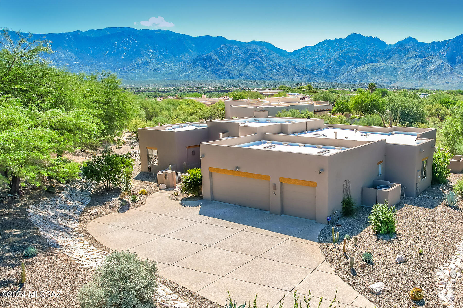 Captivating 4BD/3BA (2,764 sq ft) Santa Fe resides on a premium lot in gated Estates at High Mesa boasting panoramic views from inside & out. Charming courtyard flows to stunning open concept interior highlighted by soaring viga beam ceiling, knotty alder doors, Kiva fireplace and entertainment center. Gourmet kitchen showcases granite counters, island w/gas cooktop, built-in oven/microwave, dual pantries & desk. Owner's suite off patio hosts dual closets plus luxury bath with jetted tub/walk-in shower. Rear guest room/hall bath access pool. Amenities include 2 bay windows, 8 skylights, central vacuum, alarm, indoor/outdoor speakers, ext. 3-car garage. Adding to the ambiance of this serene setting are lush landscaping, heated pool with raised spa/rock waterfall plus mountain/sunset views.