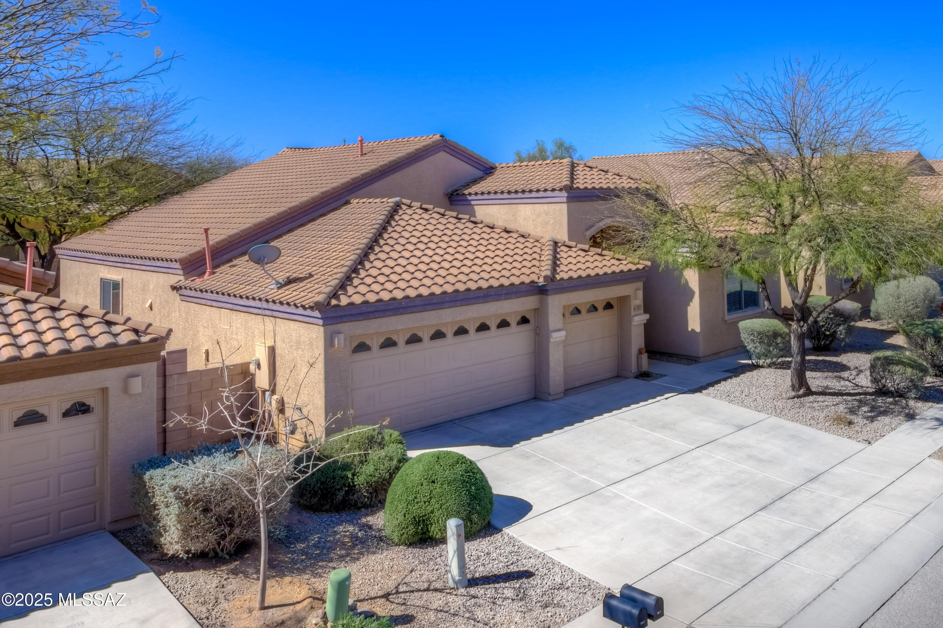 Discover the perfect blend of space, style, and functionality in this stunning 4-bedroom + den, 2-bathroom home, boasting over 2,300 sq. ft. of thoughtfully designed living space. Freshly painted in a neutral palette with brand-new carpet in the bedrooms, this home features a split floor plan, soaring ceilings and both ceramic tile and plank flooring in living areas for durability and elegance. Each bedroom is equipped with ceiling fans and double-hung closets for added comfort. The chef's kitchen is a standout, offering beautiful wood cabinetry, stainless steel appliances, gas cooking, granite countertops, an island with breakfast bar and a pantry, all with sightlines to the den and great room. A separate laundry room adds convenience, while the extra-deep 3-car garage provides ample ample space for vehicles and storage. The primary suite offers direct rear yard access and a spa-like en-suite with a soaking tub, executive-height dual sinks, a walk-in shower, private commode room, and an impressively spacious walk-in closet. The hall bath is equally well-appointed with dual sinks and a tub/shower combo. Step outside to enjoy the covered patio and paver-lined backyard, perfect for outdoor relaxation.  Conveniently located, this home is move-in ready and waiting for you!