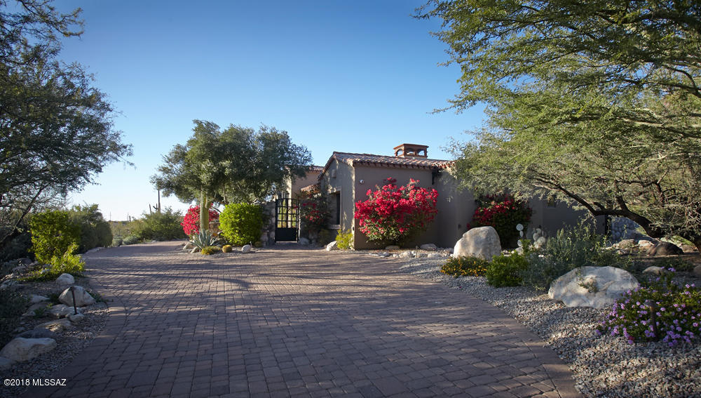 Exclusive Prime Location 
Behind 2nd Gate in Pima Canyon Estates : Lush Private Lot  : Stunning Mountain & Sunset Views :  One of A Kind : Gracious : Stylish  : Inviting  Mediterranean : Architect : Ron Robinette : 4 Bedrooms : 4.5 Baths : Spacious Guest Quarters : Refined Outdoor Living : Tranquil Pool : Spa & Fountain : Well-Appointed : Custom Materials & Finishes : Limestone & Granite Counters : Travertine Floors : Crestron Whole House Lighting Controls : Tesla Whole House Solar : Whole House Smart Panel : 4 Zone Nest HVAC Control : Heated Floors in Master Bath : Meticulously Maintained  : Peaceful  : Relaxing : Private :  Stunning Views : Please Enjoy Photos : Call for a Showing Appointment