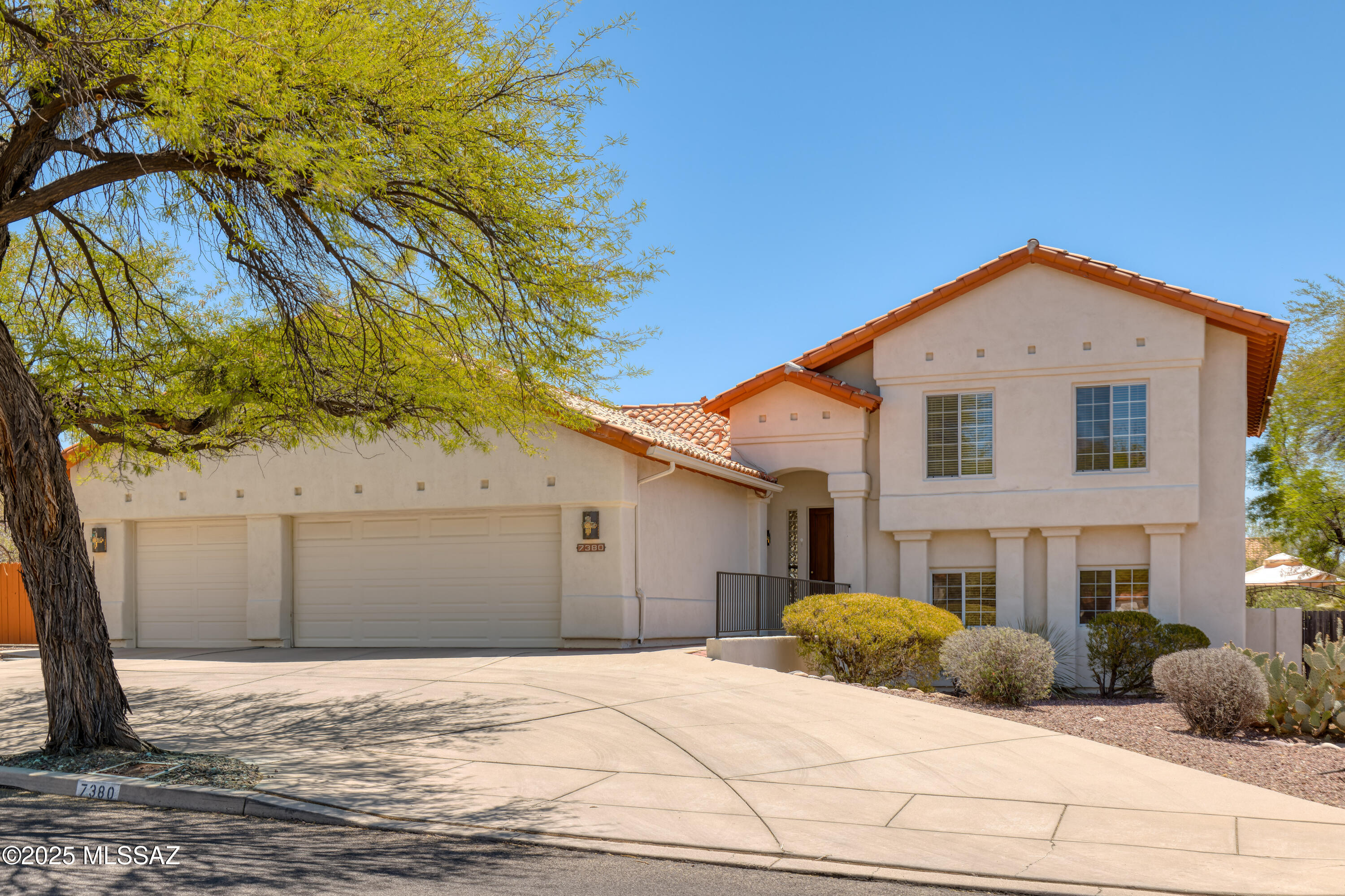 Nestled in the serene Sabino Creek neighborhood, this exquisite 5-bedroom, 3-bathroom tri-level home offers 2,676 square feet of meticulously designed living space on a generous 0.38-acre lot. Built in 1995, the residence seamlessly blends contemporary elegance with timeless charm. The multiple bedrooms and generous square footage, combined with new interior paint and carpet provide a move-in ready home.

Spacious Layout with multiple living areas provide ample space for relaxation and entertainment. The gourmet kitchen is equipped with custom cherry cabinetry, stainless steel appliances (new range), granite countertops and island, providing an ideal space for culinary enthusiasts.

The luxurious owner's suite features an updated spa-like bathroom for ultimate comfort. Walk-in shower with dual vanities and natural light. 

Large living room off the kitchen, as well as separate family room allow for fantastic entertainment options and private spaces.

The backyard is an outdoor oasis perfect for entertaining or family gatherings. Half-court basketball with turf, covered seating areas, and pool perfect for gatherings.

Extended 3-Car Garage: Includes a workshop along one wall, catering to hobbyists and professionals alike. Additional features include carpet and ceramic tile flooring, zoned air conditioning, ceiling fans, and fireplace in the living room. Masonry and wrought iron fencing, covered patios, and desert landscaping with sprinkler/drip systems.

Since purchasing, the owners have completed numerous upgrades and enhancements:

Appliances:
- Oven/stove range is brand new, 2025
- Microwave, 2023
- Fridge, 2022
- Dishwasher 2022

- New carpet
- Fresh paint

- New power window shades in kitchen, dining room, primary bedroom
- New dining room chandelier
- Updated dimmable light switches
- New kitchen fan
- New quartz island and quartz drybar downstairs
- New Turf
- New basketball court
- Repaired attic framing to allow utilization of spacious attic storage

Living in the Sabino Creek neighborhood in Tucson, Arizona is fantastic for a few really compelling reasons:

Nature at Your Doorstep: You're super close to Sabino Canyon, one of Tucson's most beautiful outdoor spaces. Hiking, biking, and birdwatching are practically part of daily life.

Peaceful Vibes: Sabino Creek is tucked away and feels private and serene, with big lots, mature trees, and desert landscaping that makes the whole neighborhood feel like a retreat.

Top-Rated Schools: The area is served by great schools like Fruchthendler Elementary and Sabino High School, which is a big plus for families.

Convenient Location: Even though it feels peaceful, you're just minutes from shopping centers, restaurants, and services. Plus, it's an easy drive into downtown Tucson.

Strong Community Feel: It's a friendly, welcoming neighborhood where people know each other but still respect privacy.