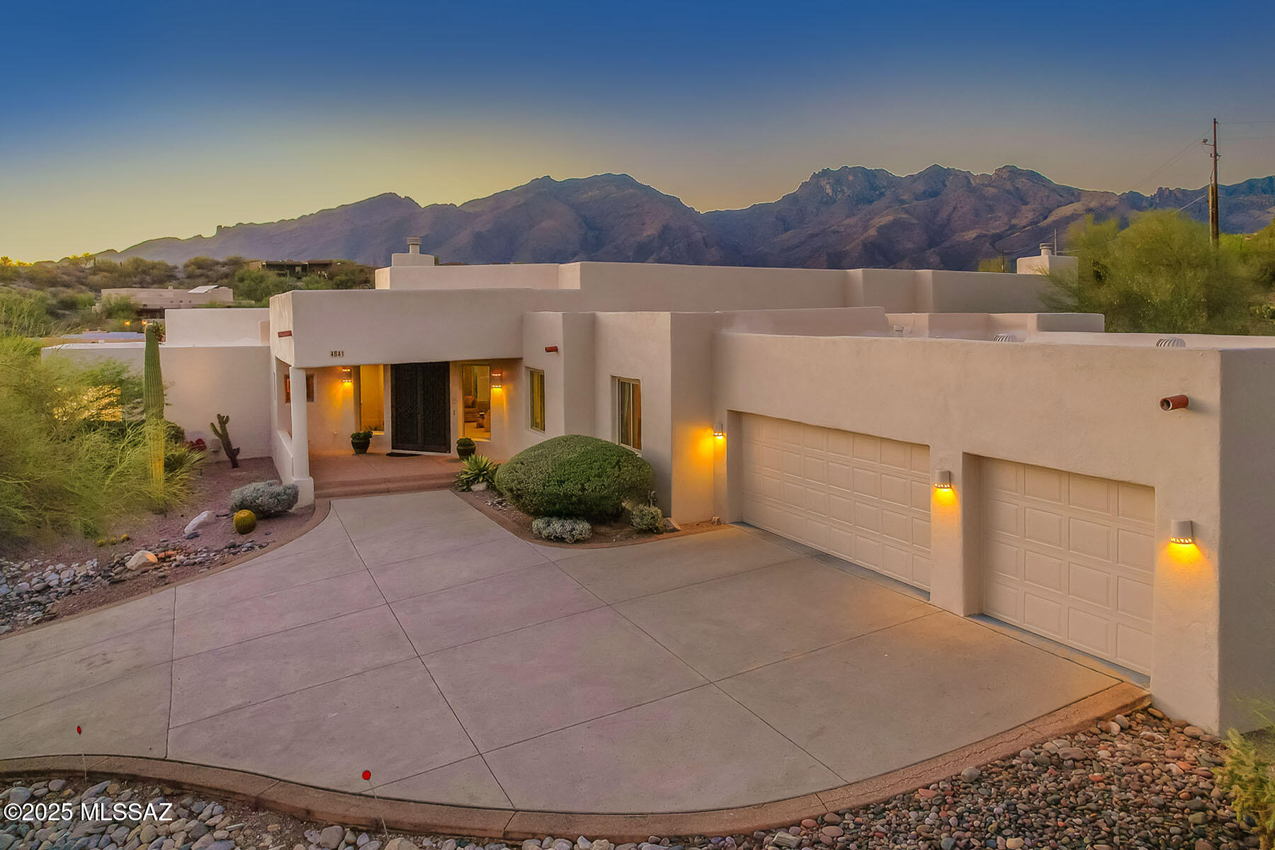 VIEWS, VIEWS! This stunning custom 4BD/3.5BA with an office, pool/spa, and 3-car garage is being offered by its original owner. Nestled on over an acre at the end of a private road—with no HOA. Soaring ceilings, wood beams, oversized windows, and many skylights flood the home with natural light. The renovated gourmet kitchen features a massive skylight above the center island, granite and quartz countertops, abundant cabinetry, gas range, walk-in pantry, and a breakfast nook that opens to the family room with a cozy gas fireplace. Elegant formal living and dining room spaces with a second gas fireplace. Recently updated primary bath offers a luxurious retreat with a freestanding soaking tub, oversized walk-in shower, and stylish finishes.  
Additional highlights include: Newer roof & HVAC, water filtration system, central vacuum, upgraded carpet/padding, large laundry room with extra storage, utility sink, second refrigerator, large garage storage closet, fresh exterior paint & stucco. Zoned for a guest house. Mature desert landscaping in a private north-facing backyard with breathtaking mountain views.
This immaculately maintained estate is efficiently built with a Rastra construction system, and located in the highly desirable Catalina Foothills school district; this exceptional property is a rare find.  Schedule a private showing to experience the beauty and comfort for yourself!