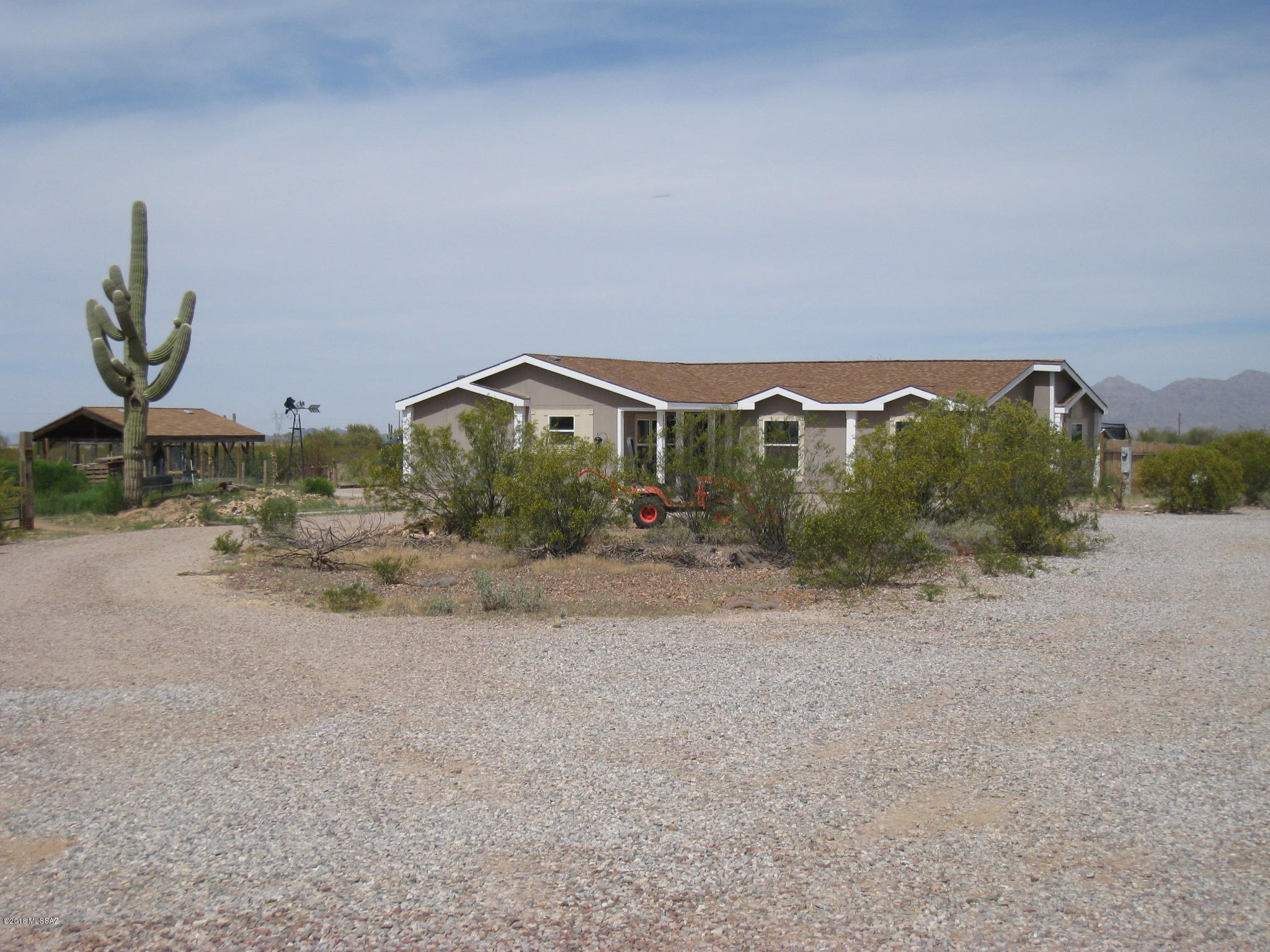 Range Pricing-Seller will consider offers between $175,000-$185,000. Beautiful remodeled home on 4 acres of horse property. Room for all of your toys!Pristine desert w/ panoramic views of mtn ranges w/gorgeous sunrises & sunset views. Gourmet kitchen features island,stainless steel appliances, & granite counter tops.Large bedrooms & additional office/den could be 4th bedrm. Master is huge w/large walk-thru closet.Ensuite master bath features garden tub & dual sinks. Energy efficient windows & ceiling fans. Horse facilities include 2 covered stalls and turn out area. Garden area & covered/fenced storage area. Country living 10 minutes off I-10 just north of Marana, Arizona Pavilions Mall & Tucson Premium Outlet Mall. This home is for you!