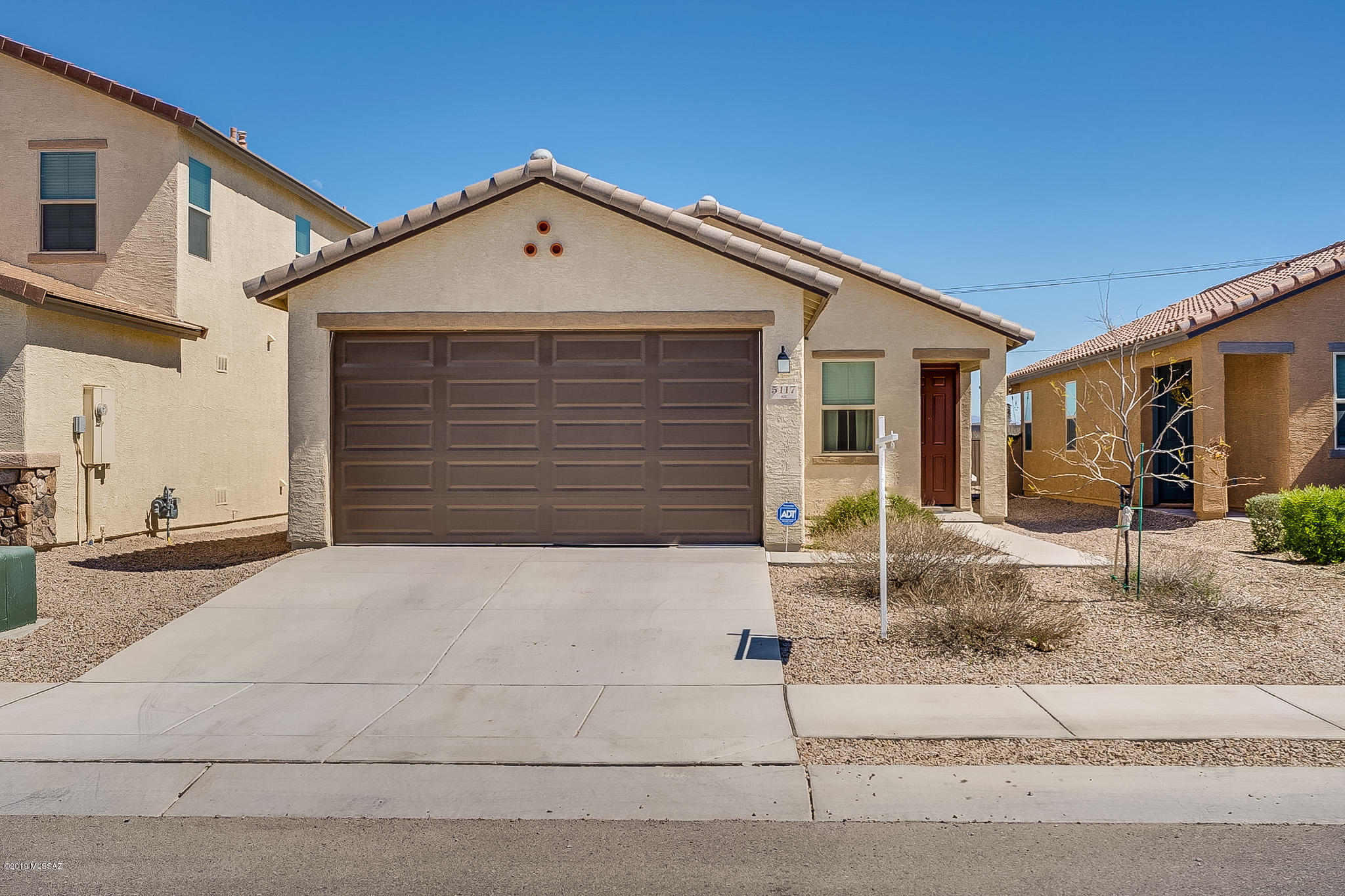 Fantastic home & awesome location combined... plus just built in 2017!! The home features 3 generous sized bedrooms, in a nice split floor plan, with 2 full & nicely appointed bathrooms. Large great room provides wonderful open concept living. The kitchen is open & includes upgraded SS appliances with lovely dark cabinets & pantry. Backyard has covered paver patio with east facing orientation, which backs to the Santa Cruz for great open space. mountain views & easy access to the bike/jogging path. All this while being minutes from Spectrum Shopping Center & I-19 access allowing you to be downtown in about 15 minutes. This is a great house with so much to offer!