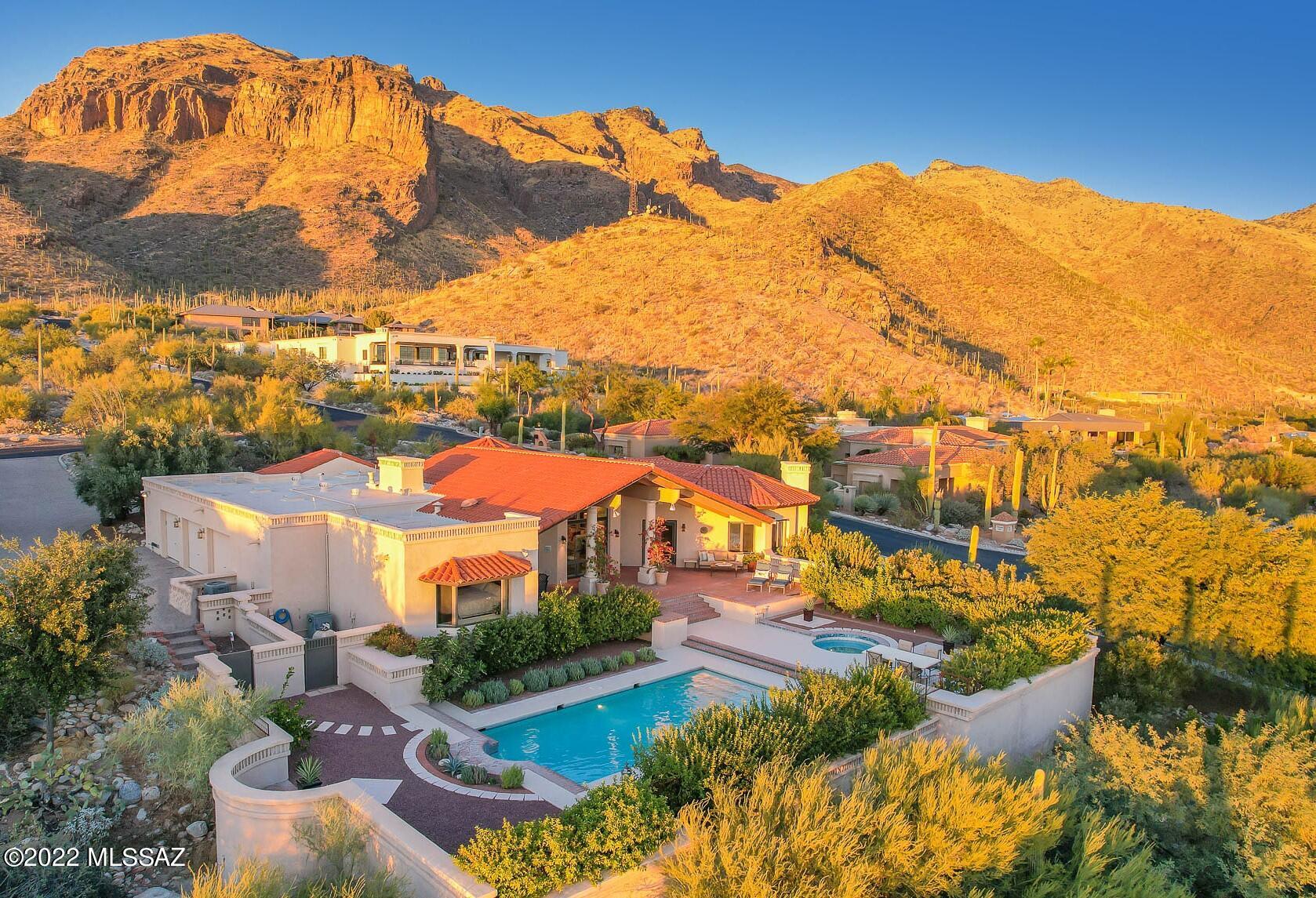 Location, Location, Location! PRIME View Property in Serene, Secure, Guard-Gated Cobblestone. David Baird Design Skillfully Captures Endless, Unsurpassed Panorama.  Architecturally Stunning Great Room Concept w/ 16' Open Beam, Vaulted Ceilings. Wall of Windows Offer Top of Tucson, WOW-Factor Perspective. Enjoy Breathtaking Sunsets & Stunning City Lights from Multiple Rear Patios. Epic Cliff Views to the North.  Revamped Landscape Plan Created Oasis of Private, Elevated Outdoor Living.  Full 2015 ReModel w/ fine finishes: 24'' Torreon Travertine Floors, Spa-Like Baths, Chef's Kitchen w/ Mahogany Cabinets, Sub-Zero/Thermador Appliances, etc. Spacious Primary Suite w/ Dual Closets & Inspiring Exercise/Meditation Room. Large 2nd Primary Suite. 3-Car Garage. Minutes to La Encantada & Banner/UMC
