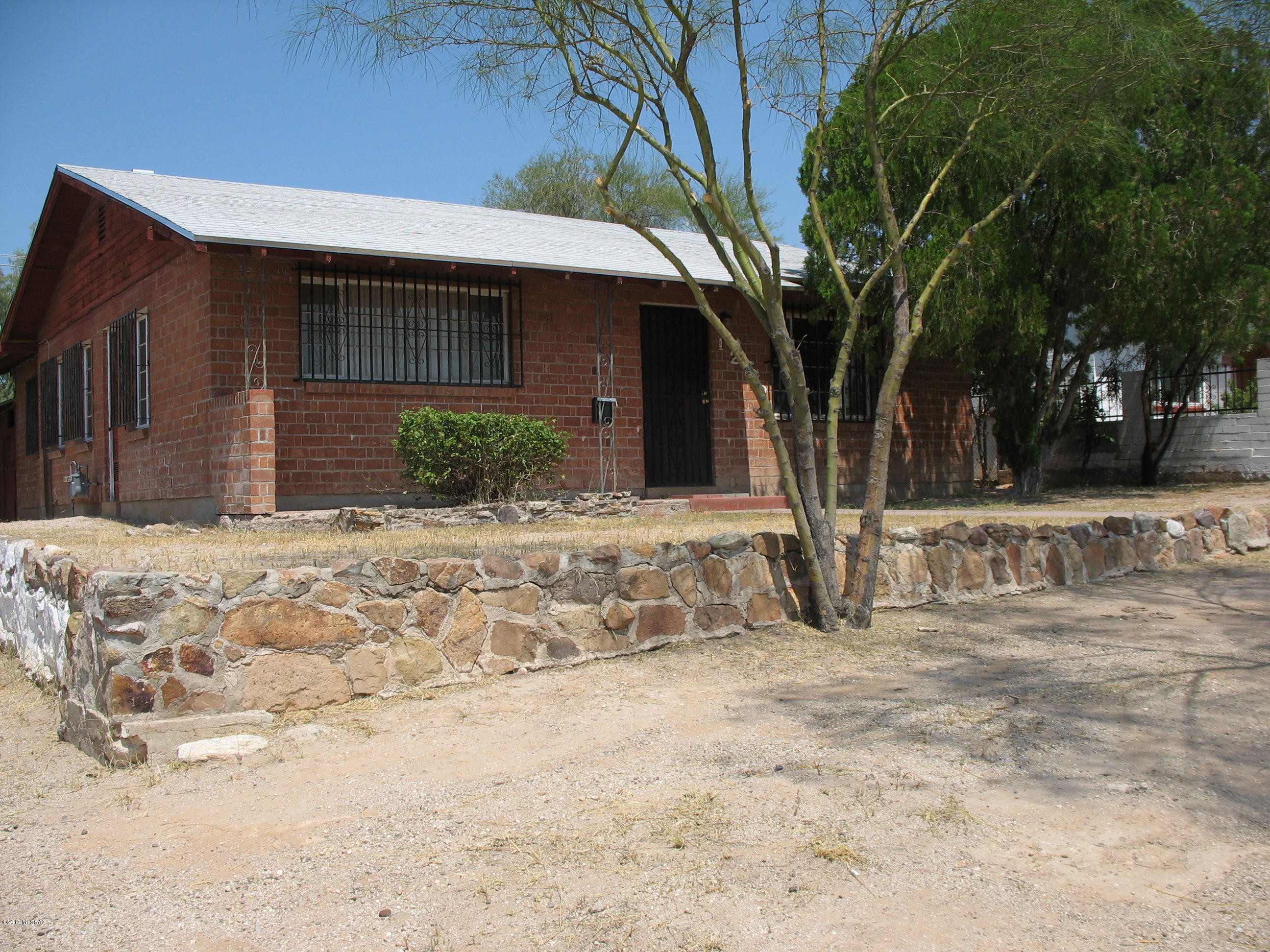 Come see this conveniently located three bedroom home! Walking distance from the U of A campus, shopping, restaurants, etc. Adorable double doors open into the kitchen-eating area. Storage shed plumbed and wired for washer & dryer. New roof aprox 2012, new furnace aprox 2016, security bars, concrete floor.