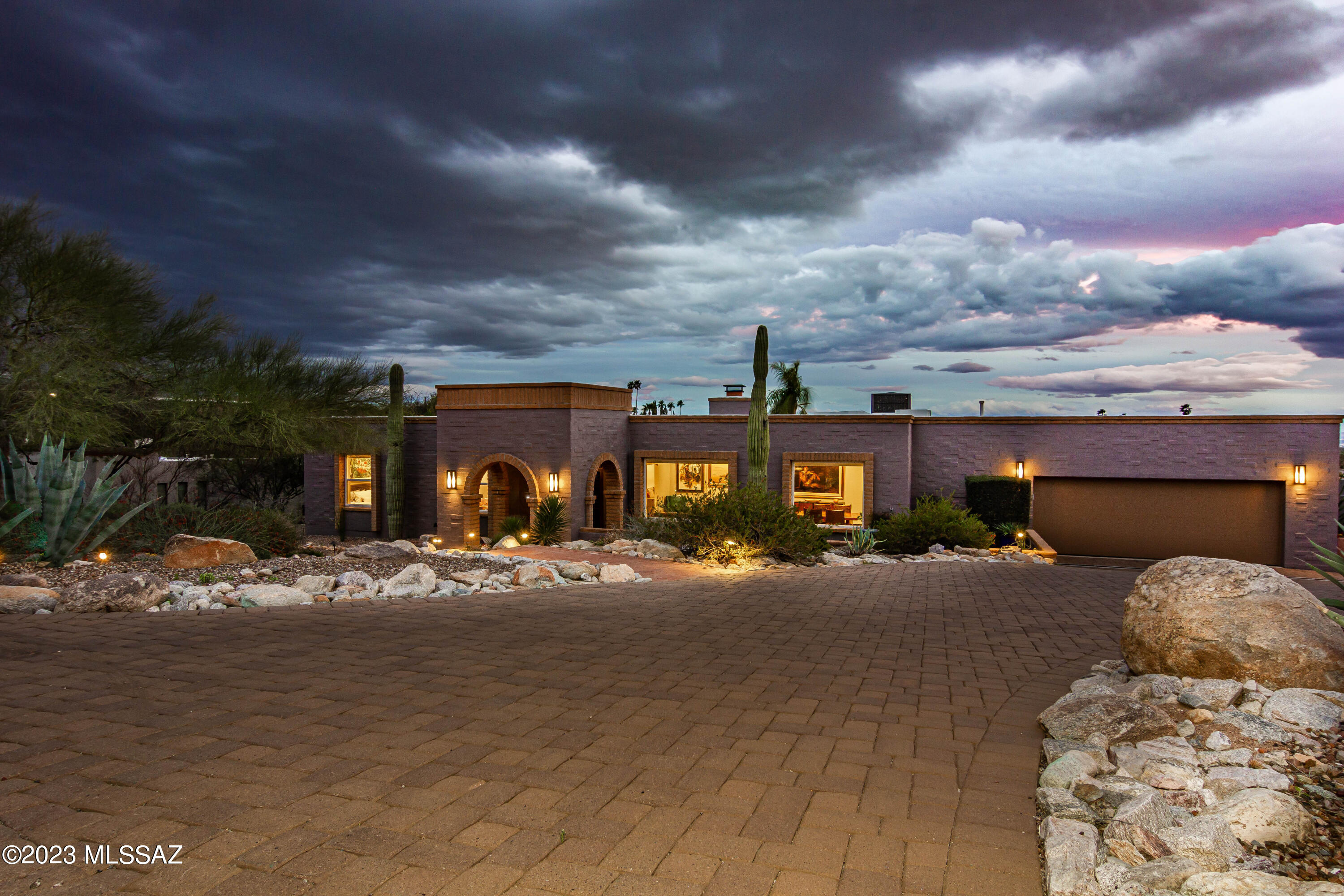 THE ESSENCE OF A REFINED FOOTHILLS LIFESTYLE IS YOURS! Enjoy LUXURY FINISHES, Mountain + City Views, and Custom Heated Lap Pool & Spa w/Water Feature + Fire Pit. Guest House/Casita- NEW in 2021. Complete Remodel in 2018, including NEW ROOF, New Flooring-Porcelain Wood Look Tile & Upgraded Plush Carpeting. Brand New Chef's Professional Kitchen with Quartz Countertops, Quartz Island w/Shelves, Wolf Gas Range, Sub-Zero Built in Refrigerator, Beautiful Custom Stained Alder Cabinets w/Pull Outs + Floating Shelves w/Under Cabinet Lighting. Butler's Pantry off Kitchen with Sub-Zero Wine Fridge. Laundry Room w/Additional Cabinet Space. Two-way Gas Fireplace w/Stacked Stone & Travertine Surrounds. Picture Windows Framing Views, w/Shades operable via remote. Primary Suite Offers Slider to Back Yard. The Luxurious Primary Bath Offers a Double Vanity with Quartz Countertops and Gorgeous Stained Alder Cabinets, Spa Shower with Custom Tile: Rain Head, Stationary, and Hand Held, with a Linear Drain. The Primary Suite features a large walk-in Closet with Custom Elfa Shelving (Moveable Shelves), as well as a Sliding Glass Door leading to the Back Patio area. 

All Window Coverings were Upgraded to Retractable Shades with remotes (except manual in living room and office), which allow sufficient light to enter, but afford privacy for the occupants. The Main House has Skylights and Recessed Lighting on dimmer switches for unobtrusive lighting, enabling the best of natural light filled spaces. 

The Two Other Bedrooms of the Main House currently function as a Guest Room and an Office. The Office Bedroom is Tiled and the Guest Bedroom offers plush carpeting with an upgraded pad. 

The Back Yard offers an Extended, Covered Patio, Concrete area with Rojo Overlay. Gorgeous Open Patio area with Tumbled Travertine is the surround for the Built-in BBQ, as well as the Pool Decking and Raised Patio, Opposite the Spa for Nighttime Viewing of City Lights and Daytime Mountain Views. The Built in Lynx BBQ offers all Trident burners, as well as two additional Trident side burners. The Pool, Spa, and Decking were completely redone in 2019-2020. The Spa has a Soothing Waterfall, which flows into the Pool. The pool is heated with Gas, and is perfect for lap swims- even in Winter! Your guests will love the multi-colored lights, which are operated from the Pentair App on your cell phone. Home has Outdoor Security Cameras and Motion Lights for Safety.  

The Guest House, a.k.a "Casita" was Built in 2020-2021. It will afford your guests and extended family the level of luxury and privacy they are accustomed to. Professionally landscaped, with engineered drainage areas, your guests will enjoy daily sunset and city light viewing on the Outdoor Casita Patio with Travertine Surround (faces south). 

Two Sliding Glass doors open to an approximately 850 square foot space, which features a mini-Kitchen with Quartz Countertops, Custom Alder Cabinets, Sub Zero Under Counter Refrigerator/Freezer, Microwave, and a Picture Window framing Views of the Mountains to the North. 

Functional areas in the Casita include a Dining Space, as well as a Family Room with wall mounted TV, and plenty of room for quiet times or board games. 

The Casita Bedroom is Large with room for a King Size Bed, a Walk-in Closet- featuring an Elfa Closet system with movable shelves, as well as a Sliding Glass Door leading to the Covered Patio area. Retractable Window Shades (controlled with a remote) make it easy to greet the day. The Casita also has its own laundry area, with a Bosch Washer and Dryer, which both convey in the sale. 

Your guests will savor the Spa bath in the Casita, featuring completely tiled walls for easy care, a Spa Shower with Stationary as well as Hand Held Shower Heads, Quartz Countertops, and Custom Alder Cabinetry. 

This One of a Kind Foothills Property is located just minutes to all major area shopping, restaurants, and amenities, and has all the bells and whistles you have been dreaming of and waiting for, as well as providing the opportunity to create a Family Compound with possibilities for multi-generational living. Providing the highest level of Luxury, as well as Curated Design- this property is sure to please even the most Discerning Buyers, and will WOW your Guests from the moment they arrive.