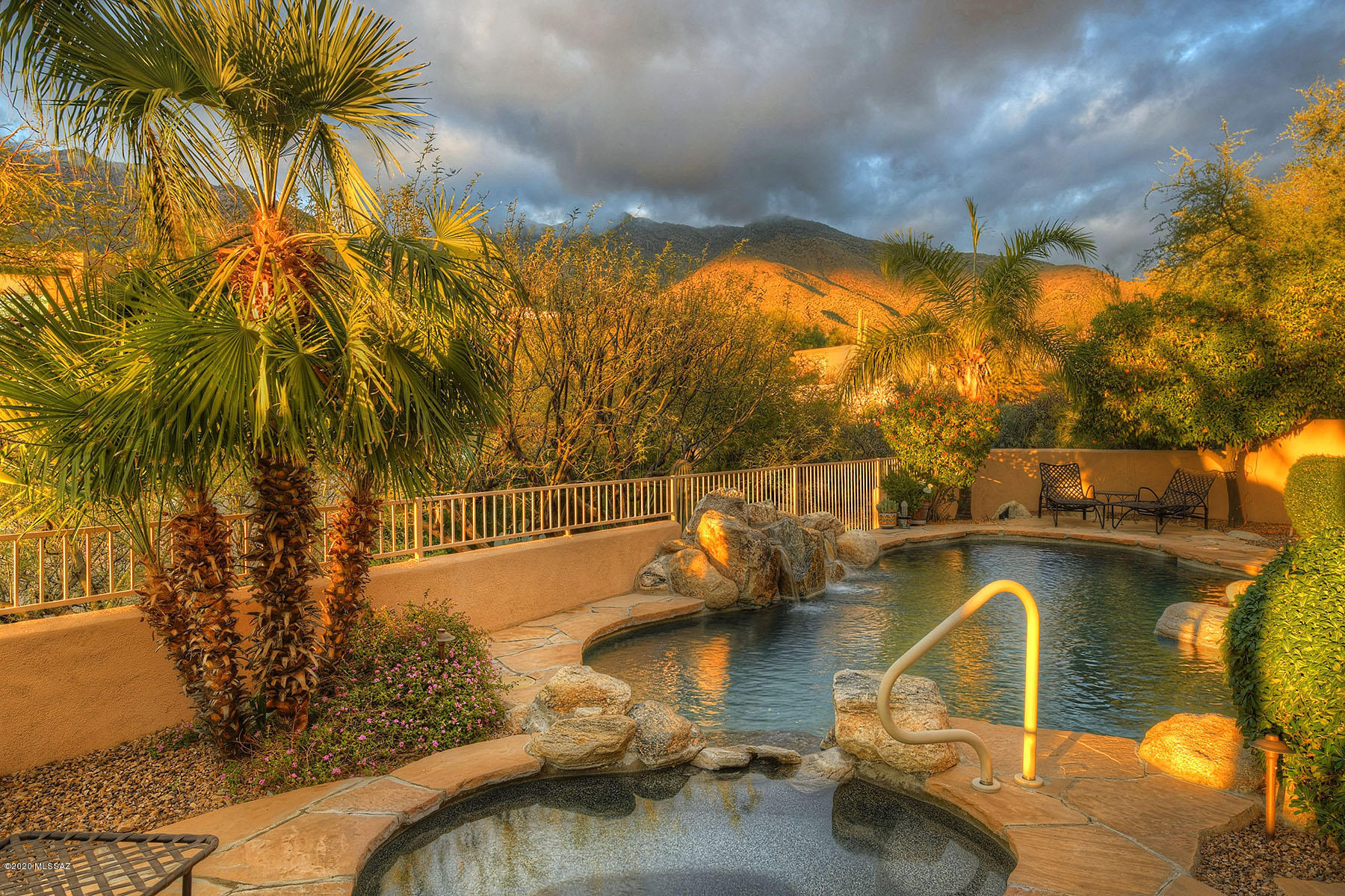 Stunning Mediterranean on Ridge with Catalina Mtn views in Alta Vista Village next to Ventana Canyon. Impeccably maintained & recently updated, this home has all the bells and whistles. Open floorplan w/15ft ceilings, 4 bedrooms/2-1/2 baths, DEN w/ bamboo wall unit, 4th bedroom custom desk & was used as a studio, chef's dream kitchen w/custom cabinetry & top of line appliances, tile & hardwood floors, custom built in cherry wood entertainment ctr in family room, rolling sunscreens & plantation shutters, custom california closets & more. Backyard is perfect size for entertaining w/pebble tec pool/spa & waterfall, mature citrus trees & amazing VIEWS!