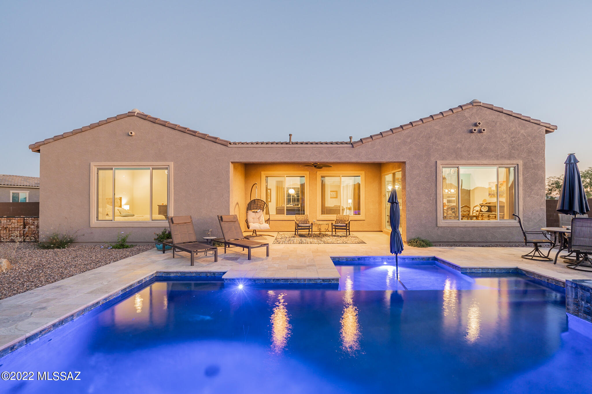 Have you been dreaming of an elegantly appointed home with a new salt water pool and spa, over a quarter acre, mountain views from your backyard and city views from the front? 
Built in 2020, the seller has only improved this already exquisite Catalina floor plan located in the premier, gated subdivision La Mirada in coveted Oro Valley. Innovation pools installed spectacular salt water pool and spa with stunning waterfall less than a year ago. Gourmet kitchen with luxurious quartz countertops, built-in gas cook-top, wall ovens and upgraded cabinets. Fabulous open-concept great room with formal dining, living room with new electric fireplace insert, stylish mantel and gorgeous tile! Serene main bedroom suite with immaculate, roomy walk-in shower and closet. Office off great room has French doors and could be used as an additional bedroom.  Split floor plan with additional en-suite with attached den! Backyard is .37 acres with added concrete pad, turf and dog run. Large covered patio to sit and take in the one-of-a-kind Tucson sunsets. Great schools nearby! A spectacular home you must see to appreciate!