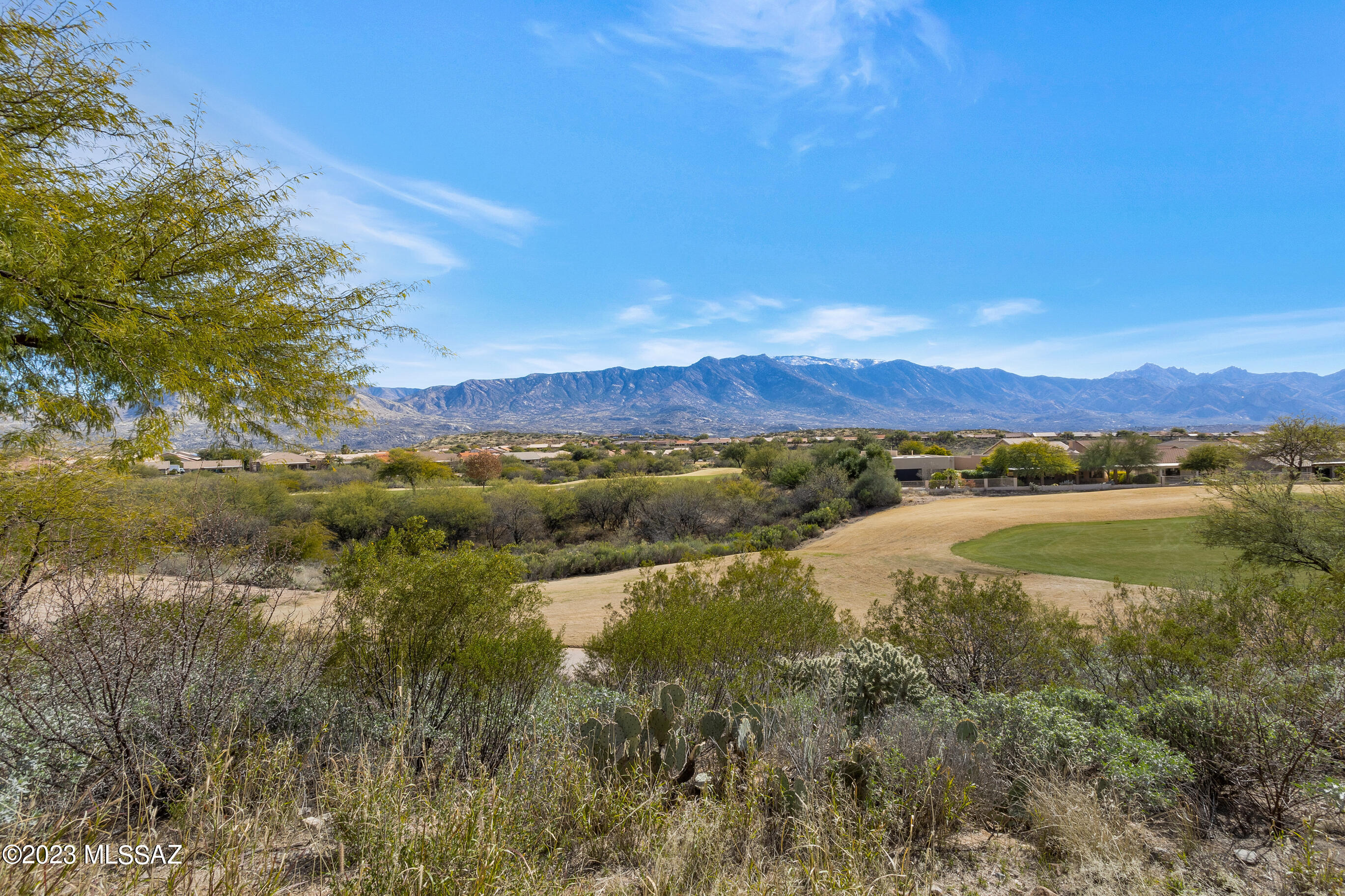 The most in living space and V-I-E-W currently available in SaddleBrooke's 40+ resort style community! From sunrise to sunset, you'll savor spectacular, panoramic mountain views framed by the green fairway below. Popular, extended 1 owner DURANGO with 4BR + Den/3 full Bath, 3 Car Garage has private backyard retreat with covered, pavered patio where Catalina mtns stretch to the horizon of city lights & the Tucson & Santa Rita mtn ranges beyond. Flexible layout w/Owners Suite, BR 2 and Full Bath 2 downstairs and 2 BR/Bath ''Upstairs Casita'' offers options for 1st floor guest accommodation, 2 offices/ craft/media/game room rooms. Beautiful, practical L + island kitchen layout w/gas cooktop + newer stainless steel refrig, NEW work sink/faucet & dishwasher (SS wall oven/micro coming soon) Premium lot is conveniently located to community entrance, HOA 1 & MountainView clubhouses. Preinspection performed including certification of 3 HVAC units by 2-10 Home Warranty, repairs completed, and interior freshly painted. This well-maintained property is move-in ready for its next owners to personalize and enjoy an unparalleled active adult lifestyle at this premier address!