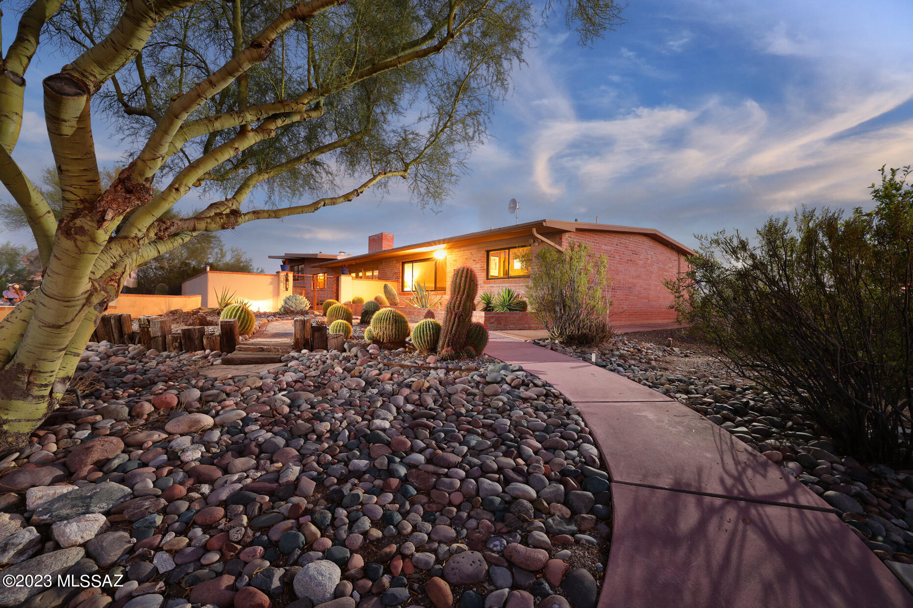 When you talk about the old Catalina Foothills, you talk about Catalina Estates #3 and of course, the heart of Cat #3 is N. Via Alcalde.  This beautiful haciendia-style brick home abounds with ''Old Pueblo'' warmth and charm mixed with stylishly renovated interiors.  Four bedrooms (two Primary) and five bathrooms, including a 981 sq ft guest house.  Saltillo flooring throughout, Talavera tile counter tops, stainless steel appliances, 3 fireplaces, 2 car garage, pool, beautiful mountain & city lights view. This is A MUST see for the discerning buyer. Please allow 48 hours for sellers response. Open house Sat Aug 12 and Sun Aug 13 1 to 4 pm
