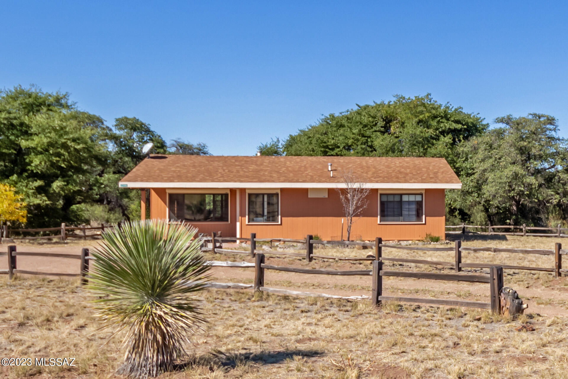 Get away from the hustle and bustle to this PRIVATE RANCH HOME located on Rock Creek at 5200' ELEVATION. This INCOMPARABLE property not only has Rock Creek water rights but is also located in the Chiricahua foothills. The home has 2 sellable water shares and a 10,000 gallon water storage tank. NEW ROOF, NEW EXTERIOR PAINT, DIVIDABLE, multiple fencing including deer fenced fruit trees. Home features a SimpliSafe security system, motorized security shutters, zoned Cochise RU-4. Two entrances to the property; one at Sunrise and one at Quail Hollow Dr. Small apartment located at water storage tank. Storage Bldgs. Fiber optic available through Valley Telecom. Only 15 minutes to Chiricahua Ntl Monument entrance and 30 min to Willcox. Less than one hour to the Bisbee-Douglas Itrntl Airport.
