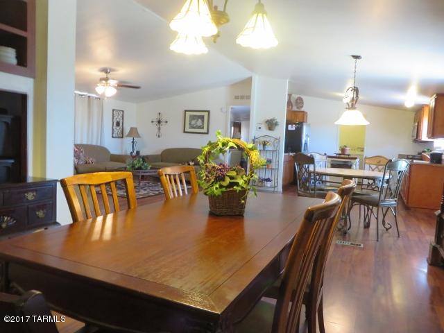 Lovely spacious home locally referred to as The House On The Hill as it sits high on a knoll. Huge great rm boasts newer faux wood floors and lots of windows to make it light and inviting. 
All windows on rear of home had recently been replaced. The chef will enjoy the spacious kitchen featuring stainless steel appliances and a portable island. You will get the WOW effect when you enter the huge Owners Suite with large retreat area. Additional 3 bedrooms are at the opposite end of the home. Outside drive up the circular drive to enter. Out back relax on the elevated deck to take in amazing views. Pets or children can enjoy a chain linked yard area with attractive tree for shade or the concrete patio slab. More desired amenities are ceiling fans with lights & heat pump heating & cooling