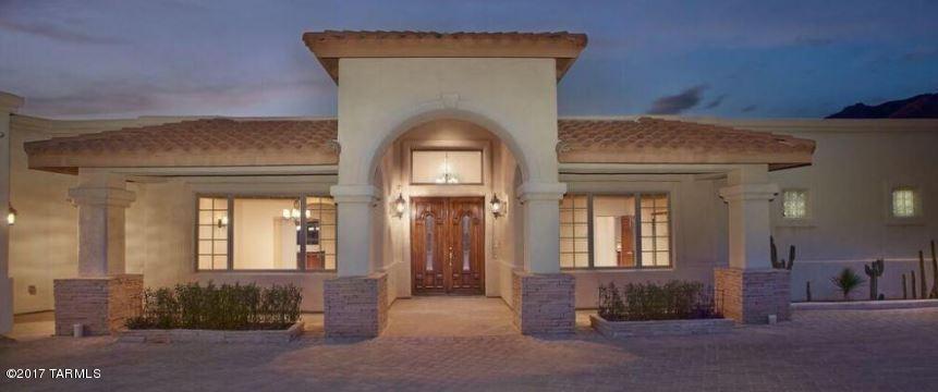 NEW PRICE!! The Spanish name implies……”HOME OF DREAMS.”   Custom built by the owner, this Mediterranean 5 bedroom and 4.5 bathroom home offers 5047 sq ft of magnificent ambiance.  There is a formal living with fireplace and formal dining room, office/bedroom, gourmet chef’s kitchen, all with custom cabinets and granite counters.  Stainless steel appliances, eat in breakfast area, breakfast bar, all with spectacular views of the Catalina Mountains.  Adjoining the kitchen is an impressive great room with fireplace, mountain and sunset views, wet bar and access to the large covered deck which runs the entire length of the home.  The master suite has a beautiful fireplace, access to the deck and a grand ensuite with Jacuzzi tub and large master closet with dressing room. SEE ADDITION