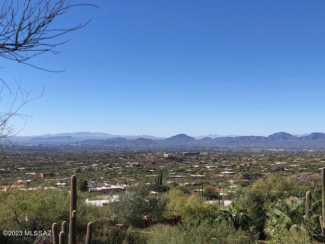 Unobstructed views OVERLOOKING ALL of TUCSON and SURROUNDING MTN RANGES. You'll never tire of these AMAZING VISTAS. Intimate, 11 lot, 9 house gated neighborhood at the north end of Swan Road borders the NATIONAL FOREST and is comprised of some of Tucson's FINEST CUSTOM HOMES. The North/South oriented lot lends itself to a multi-level or two story design with plenty of room for a substantial plan, See Documents for a list of HOA variances given to this site, easing the bldg process. You'll enjoy excellent and quick access to all FOOTHILL'S amenities as well as central Tucson's cultural resources. Only currently available site in this UNIQUE SUBDIVISION, THE SUMMIT. There are no comparable view lots in the foothills at this price!