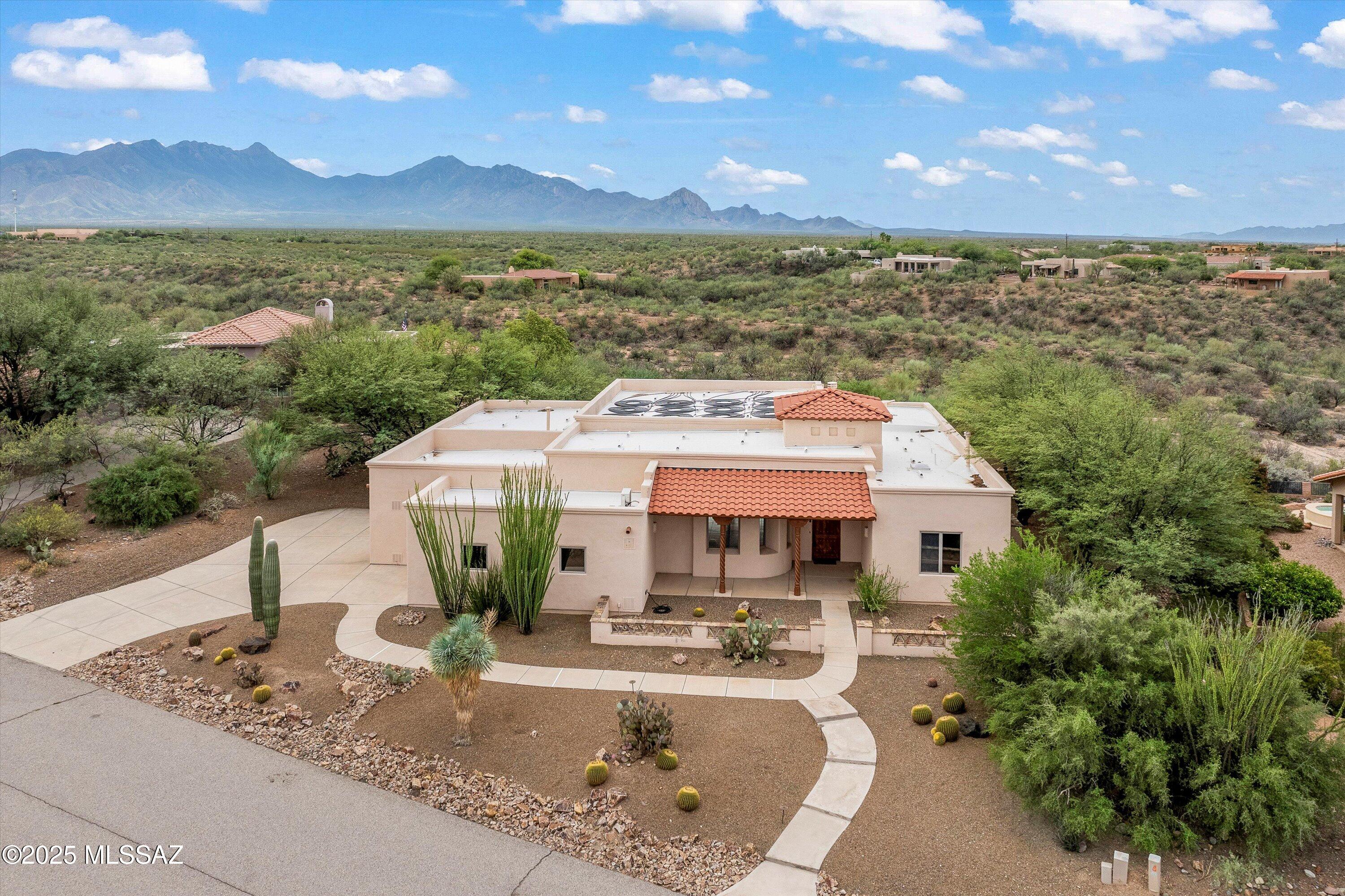 Stunning 3-bedroom + den home w magnificent panoramic mountain views. This home has thoughtful upgrades throughout. The spacious floor plan features a beam-accented ceiling, fireplace, and neutral tile, interior was painted in Jan 2026, alder doors and abundant storage. The chef's kitchen is complete with electric oven, gas cooktop, slide-out cabinetry, and reverse osmosis. All bedrooms offer a walk-in closets. Outdoors, enjoy true resort-style living with a lap pool, built-in BBQ, and large covered patio. The 3rd-car garage can be used as studio or workshop with its own mini-split for year-round comfort. All 3 garage bays are extended in length and width. This home is perfect for those seeking both luxury, versatility with breathtaking views as the backdrop.