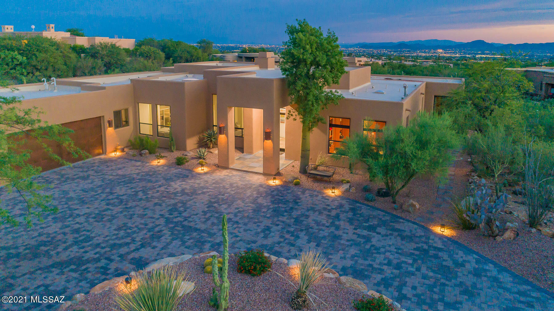Stunning contemporary home in Pima Canyon Estates with city and Mountain views and offering privacy and surrounded by lush vegetation and majestic saguaros.
4 bedrooms or 3 bedroom plus den/office and 3 bath, open floorplan, natural stone flooring in living areas, 2 fireplaces. Gourmet island kitchen with granite counters, stainless steel appliances & breakfast nook.
Entertainers dream with extended covered patio, cozy seating area with fireplace, heated pool and spa. Brick paved circular driveway and 3 car garage. Must See!