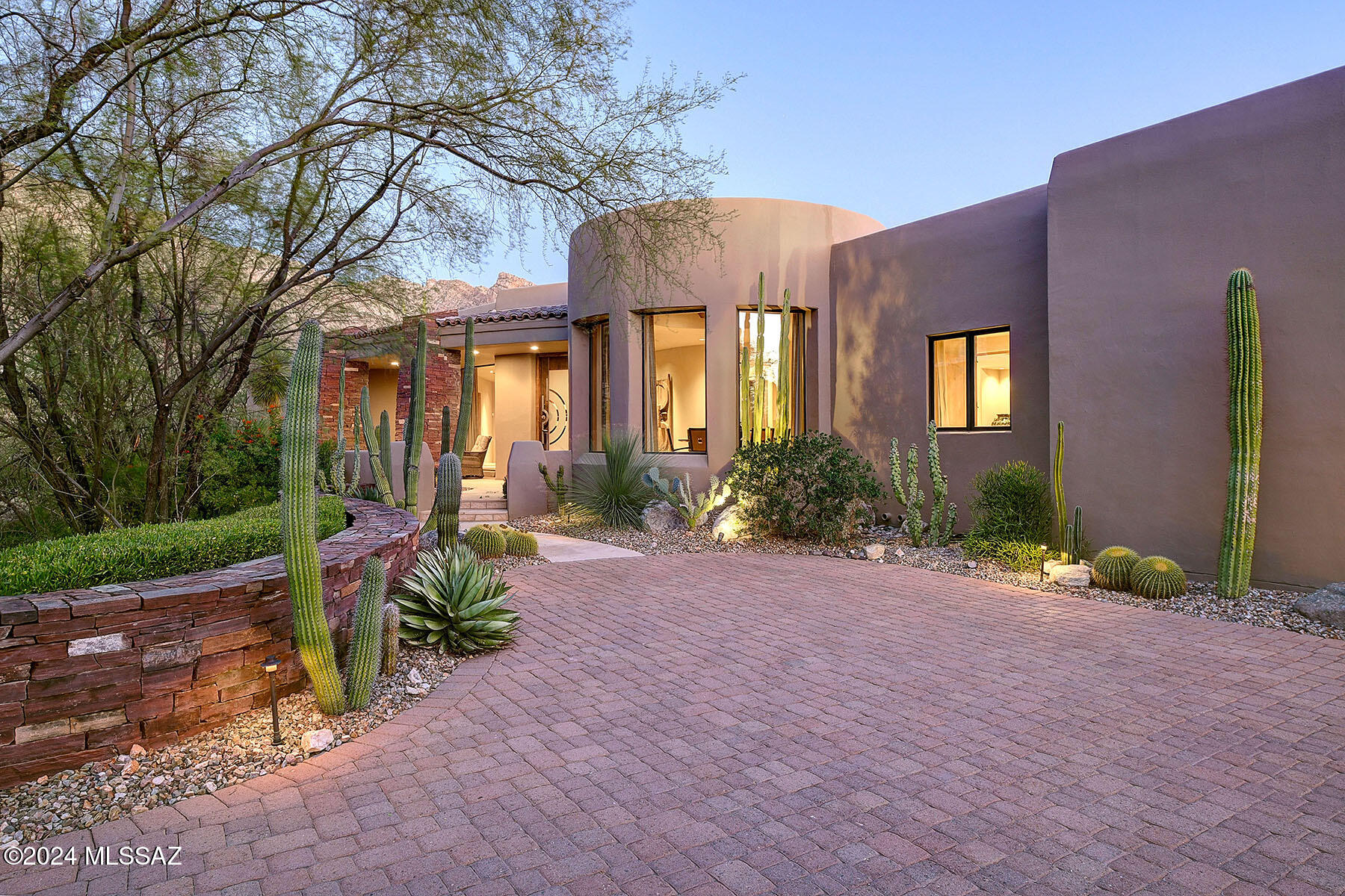 Stunning Southwestern contemporary in gated, prestigious The Canyons, by quality builder RB Construction.  Outstanding architecture, construction, art sense and attention to detail describe this 4-bedroom (den with closet and built-in bookshelves could be 4th bedroom), 3 ½-bath, 4,154 sq. ft. and oversized 1,069 sq. ft. 3-car garage home.   Access property over paver driveway with stacked-stone retaining walls, to front entry with flagstone floor, artist-made copper and glass entry door, into foyer and living room with flagstone floors, soaring cross-beamed ceiling with walls of windows, stacked-stone fireplace and 8' alder doors throughout.  Gourmet kitchen features granite counters, center island with prep sink, stainless steel appliances including 6-burner Viking professional gas range and Sub-Zero fridge, walk-in pantry, and breakfast nook.  Formal dining room has walls of windows and wine cooler.  Gracious primary suite offers stacked-stone fireplace, dual sinks, spa tub, walk-in closet, Turkish travertine tile in bath, European plumbing fixtures and Italian custom mirrors.  Professionally landscaped backyard has oversized porch with stacked-stone columns, flagstone flooring, pool/spa with waterfall, built-in BBQ, and so much more.  See to appreciate!