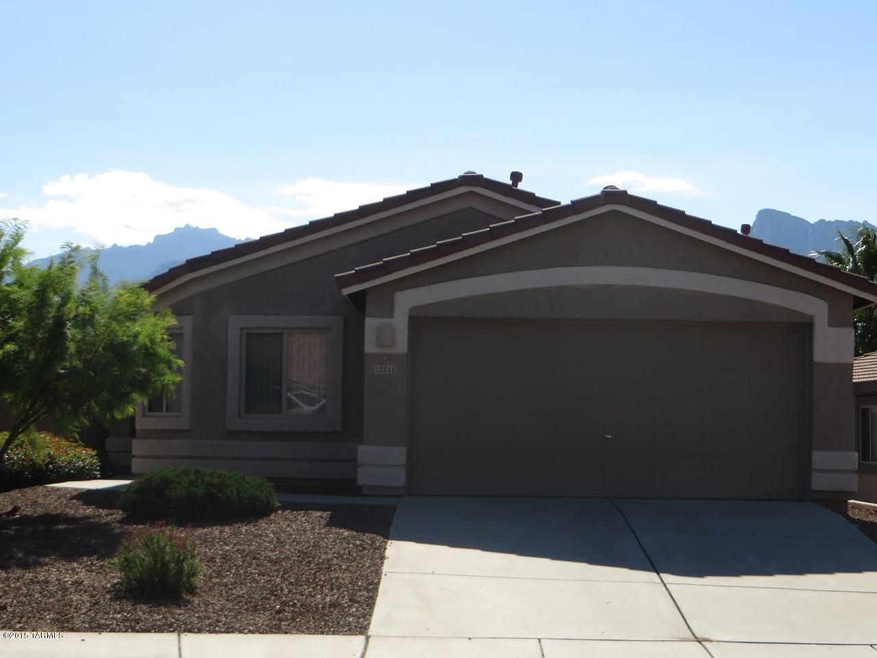 Bright open floor plan just painted in designer color. Vaulted ceilings, Den or Dining Rm off Great Room, Eat in Kitchen. Wired for Surround Sound. All tile floors. Ceiling fans w/remotes. Master bathroom upgraded with separate tub & shower. Laundry room w/washer & dryer.  Private back yard w/covered patio.