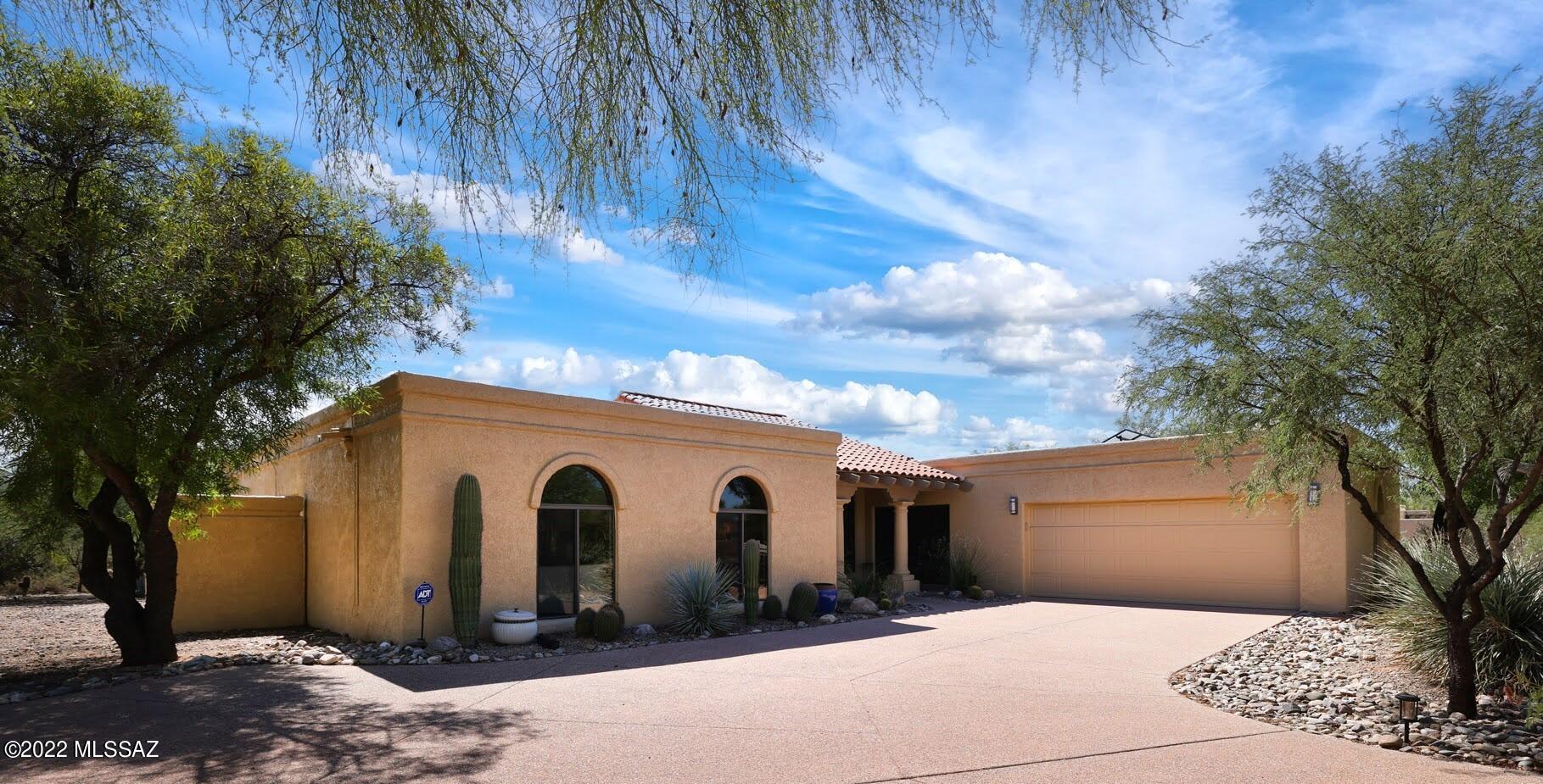 Don't miss this fabulous, light filled home in sought-after Shadow Hills! Beautiful entry w/gracious columns welcomes you through the dbl door entry & into the stunning living rm w/sky-high vaulted ceilings & elegant FP flanked by lrg picture windows. Spacious kitchen offers a lrg island w/induction cooktop, granite counters & is open to the family rm w/cozy FP. Charming breakfast nook offers bay windows & formal dining rm is accented w/cove ceiling detail & gorgeous wood floors. The generous primary suite features dual sinks & lrg roll-in shower w/glass block detail. Wonderful backyard offers a classic pebble-tec pool, extended covered patio & easy-care desert landscaping. 2 addl bedrooms, full guest bath & updated powder rm. All this plus Owned Solar, 2 car garage & plenty of parking.