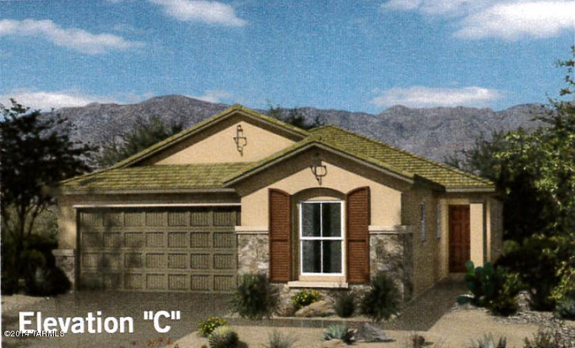 Best selling one story home with den. 9' ceilings for added volume, popular flush kitchen island.  Beautiful 42 inch upper maple cabinets with crown molding in Kona finish.  Raised panel interior doors with upgraded Dorian Lever hardware.  3-1/4 inch baseboards will complete your tile and upgraded carpet flooring.  Relax under covered back patio with view fencing.  View model home of this plan today and see all that Rancho Sahuarita has to offer.  Move in ready now!