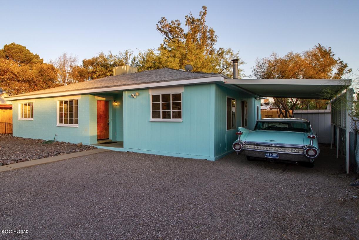 The River Park neighborhood is a quaint group of postwar ranch homes just south of the U of A Campus Farm. This eclectic and quiet community is only two blocks from the Mountain Ave bike path to the University Campus. The Rillito River trail, Trader Joe's, and Sprouts Market are all within a one mile radius, and can be accessed via residential streets.  This great house has had only two owners since it was built in 1951, and was the only custom home in the subdivision.  It is extremely well maintained, and features polished concrete floors, coved ceilings, and a nifty 1960's freestanding fireplace. The original kitchen still retains it's O'Keefe and Merrit stove, along with the  vintage tile backsplash.  Third BR is an AZ Room with closet.  Owner is a licensed  Real Estate Agent in AZ