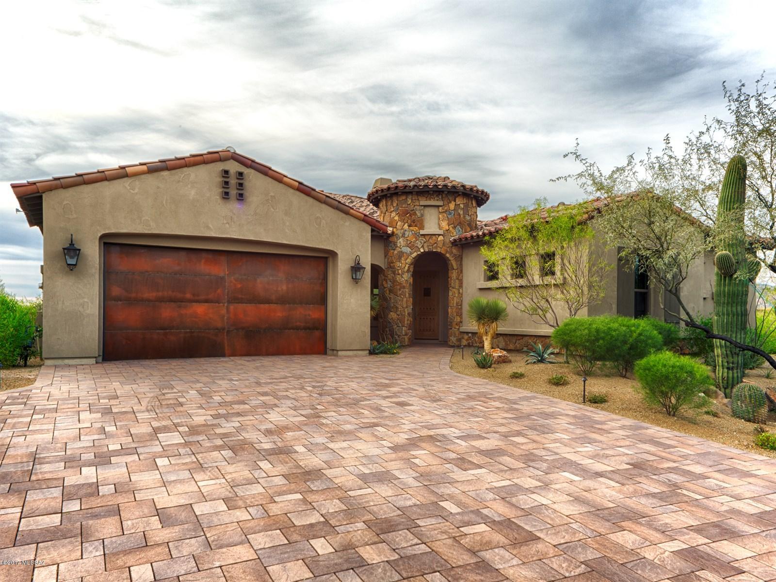 Brand NEW Energy-Efficient home ready NOW! The circular foyer entry is just the prelude to luxury living. Gourmet kitchen with expansive island. This Ocotillo Plan has Bridgeport Maple Karman cabinets, Isokern Linear fireplace, upgraded granite at kitchen and baths, mud set tile in shower surrounds, two tone paint, multi-side patio door off of the great room, upgraded flooring throughout. You'll be able to enjoy your fully landscaped yard with lots of privacy and gorgeous natural Sonoran Desert landscape and huge Boulder outcroppings. Love living in the gated community of Stone Gate at Stone Canyon with the beautiful golf course. Known for their energy-efficient features, our homes help you live a healthier & quieter lifestyle while saving you thousands on your utility bills.